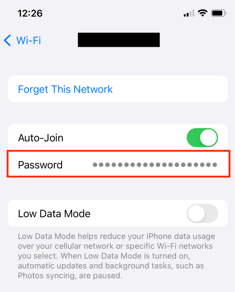 Tap the series of dots to reveal the Wi-Fi password on an iPhone. 