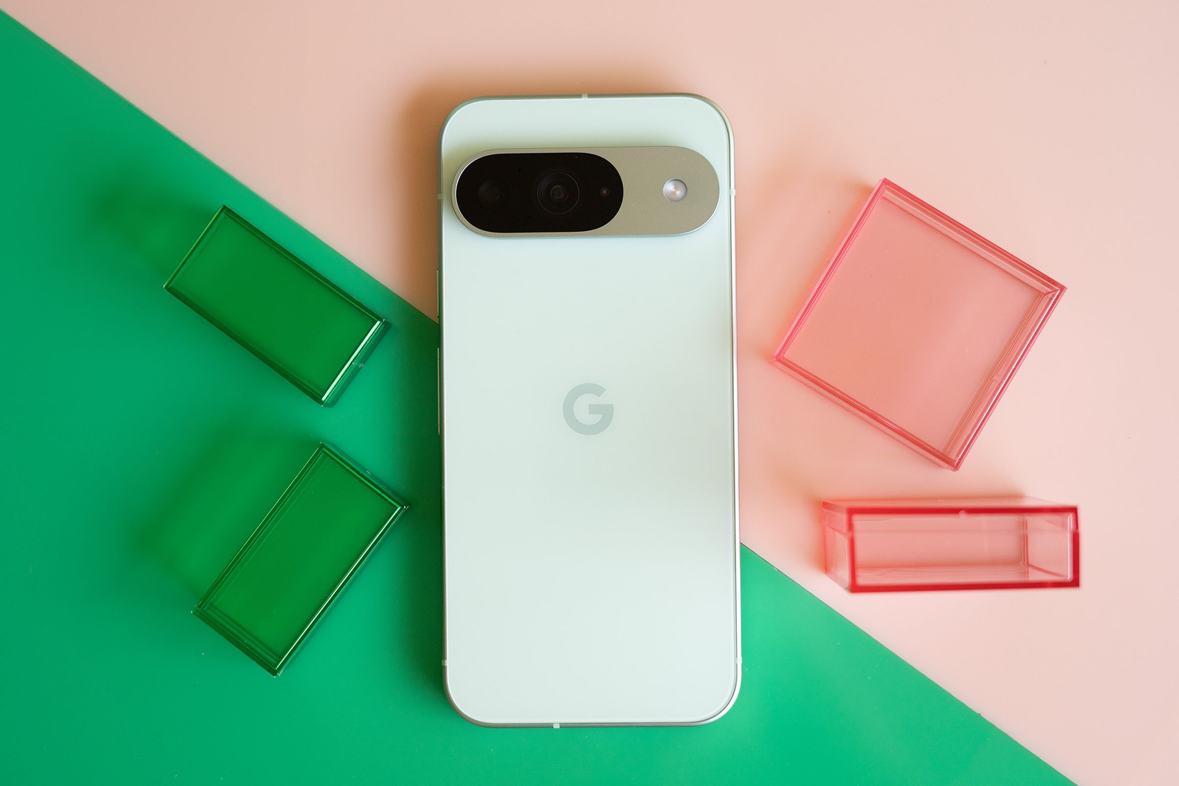 Google Pixel 9 on a pink and green background.