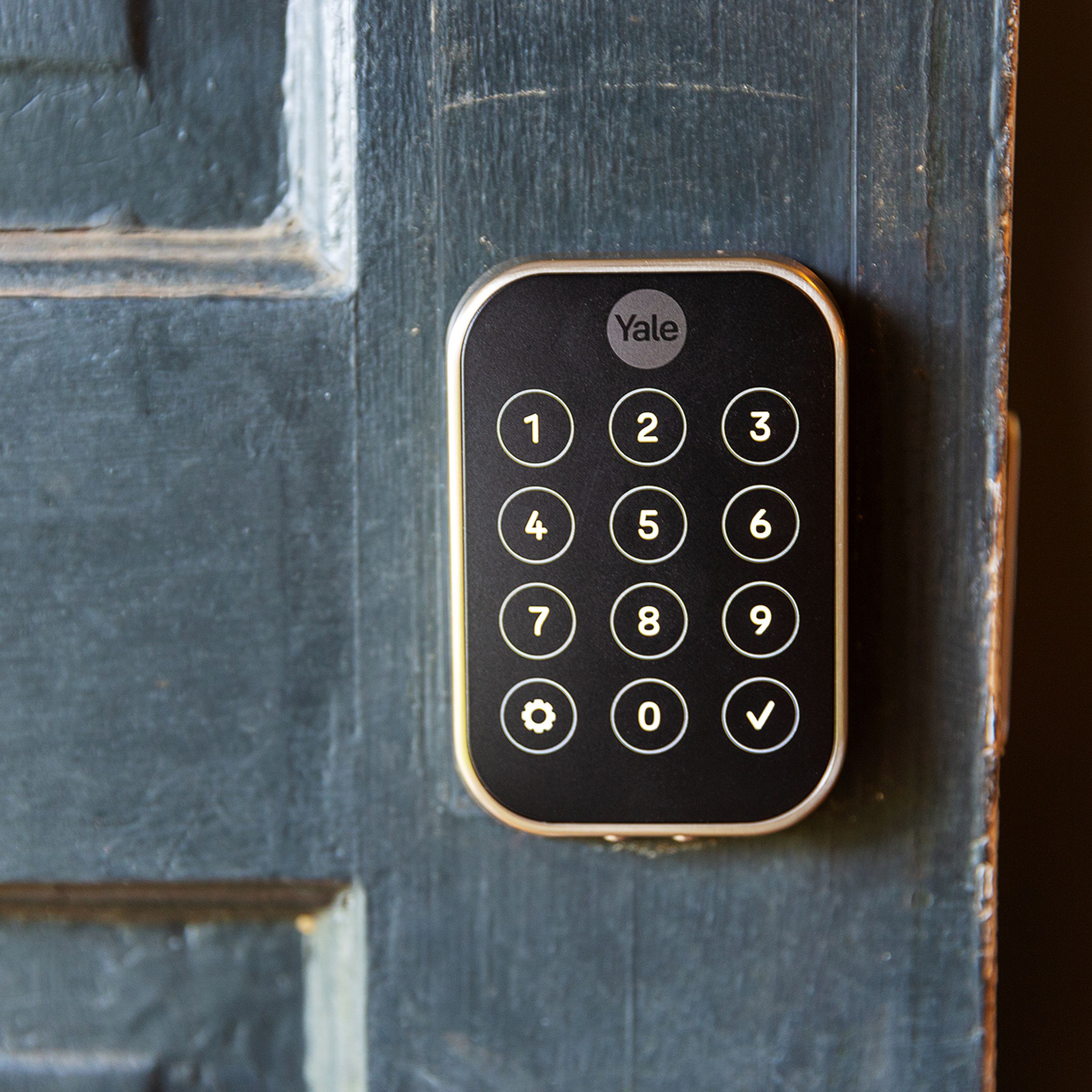 A touchscreen keypad on a door.