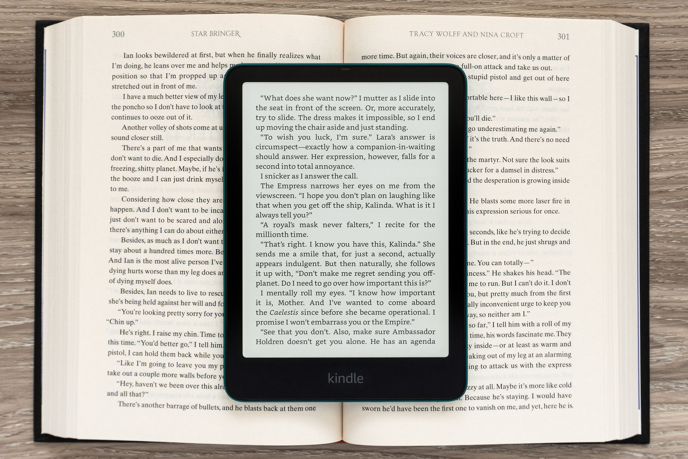 The Amazon Kindle Paperwhite Signature Edition (2024) displaying a page of text sitting on an open book.