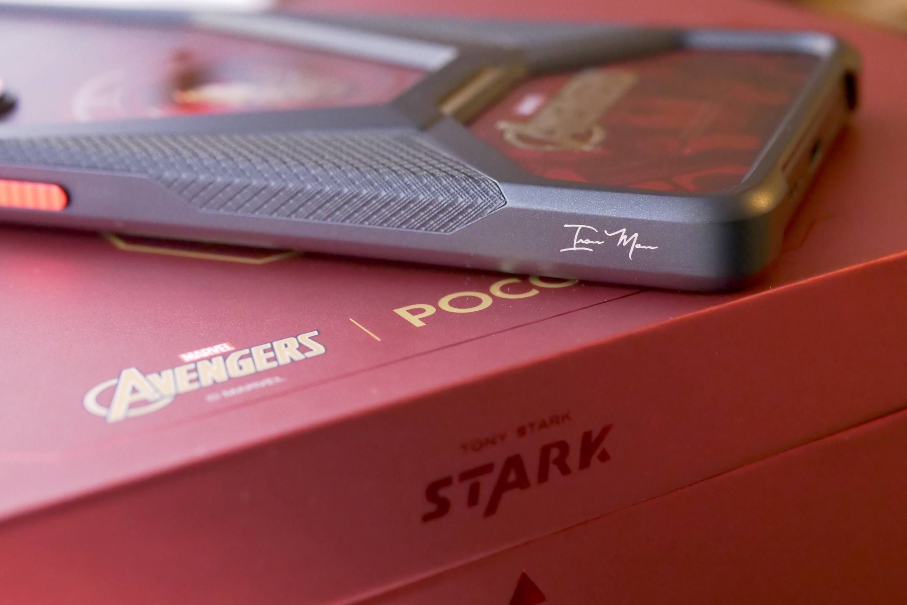 The Iron Man signature on the Poco X7 Pro - Iron Man Edition's case.