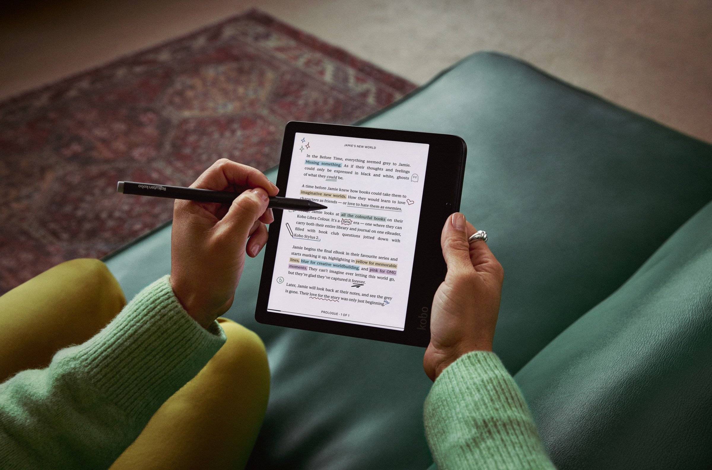 A hand using a stylus to take notes on the Kobo Libra Colour e-reader.