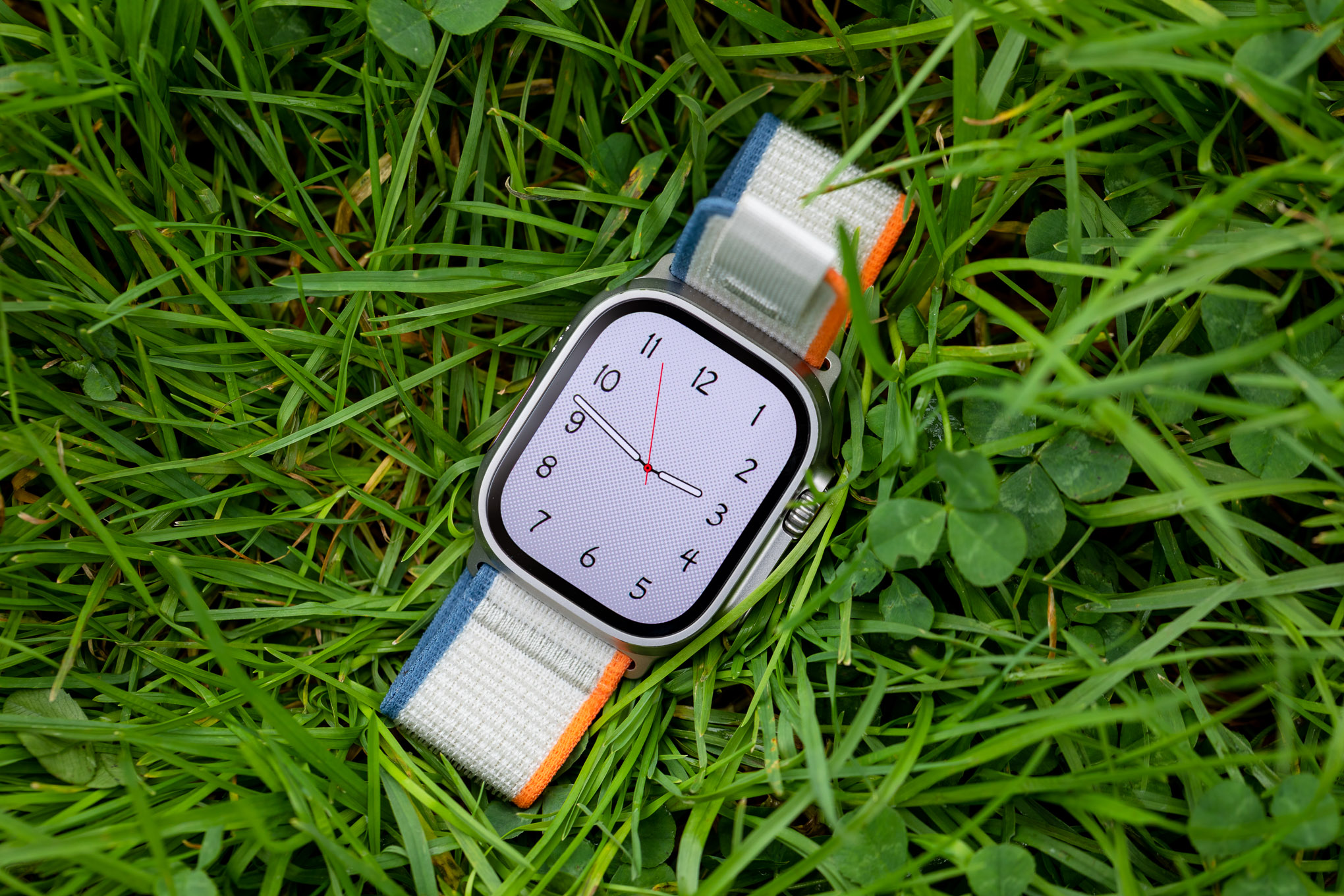 The Apple Watch Ultra 2 on grass.