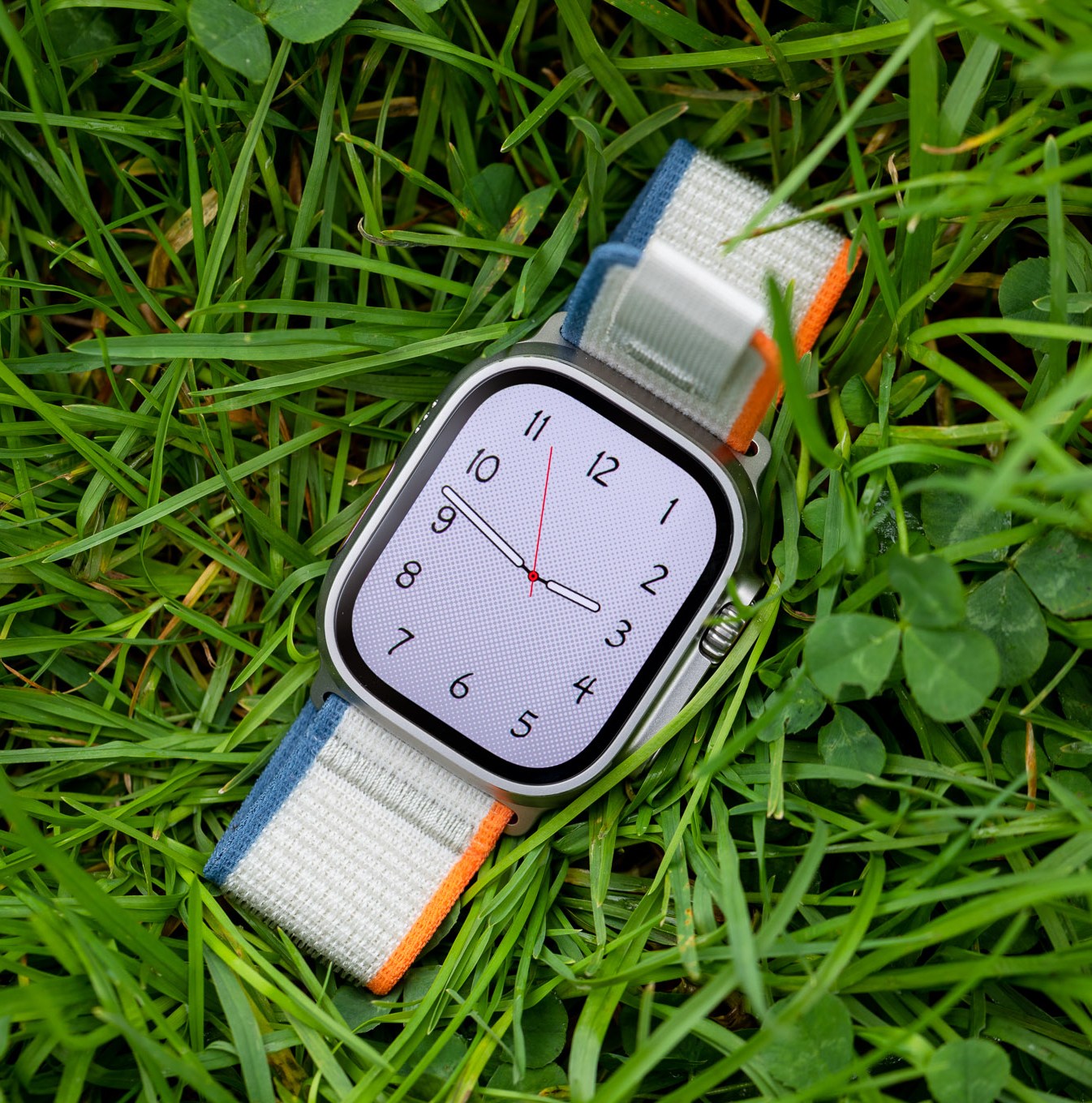 The Apple Watch Ultra 2 on grass.