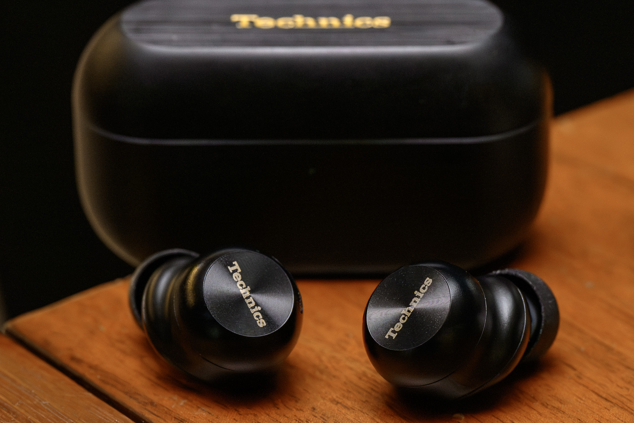 A hands-on photo of the Technics AZ100 earbuds.