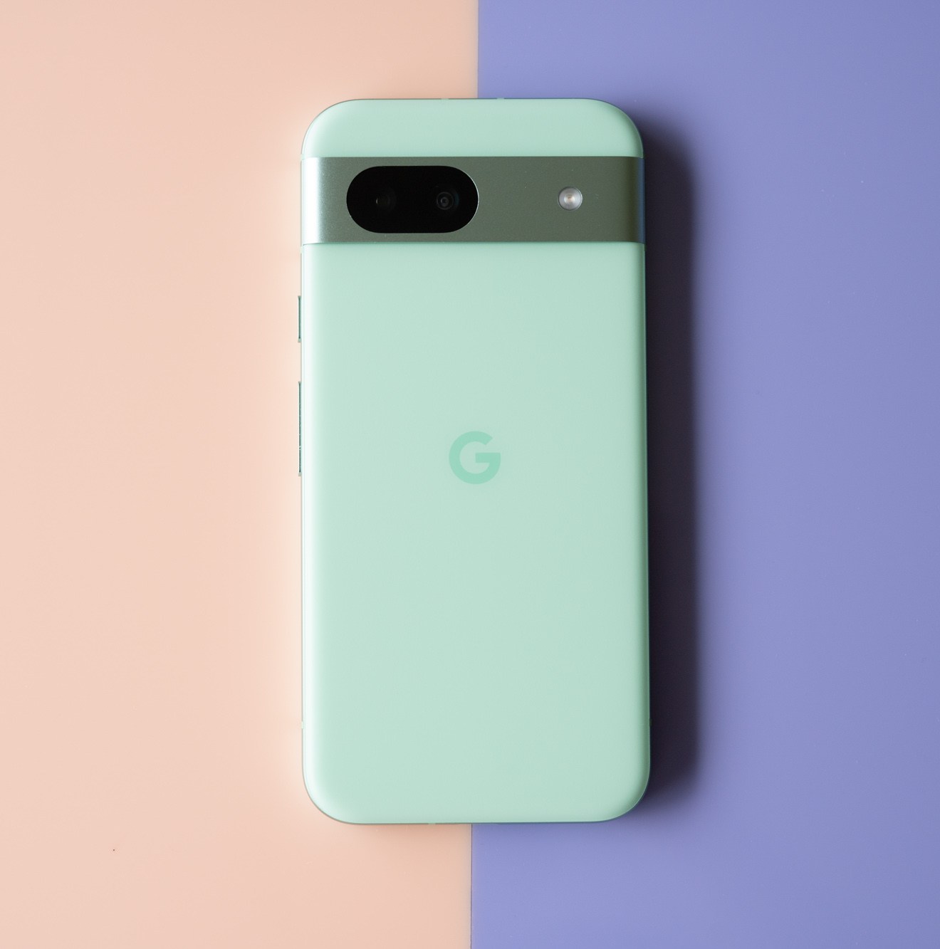 Google Pixel 8A in aloe green showing back panel.