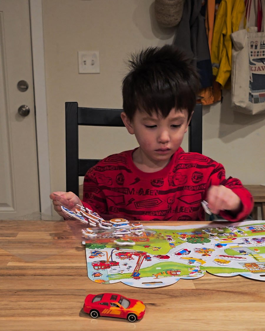 Screengrab from the S24 Ultra of a child at a table playing with stickers