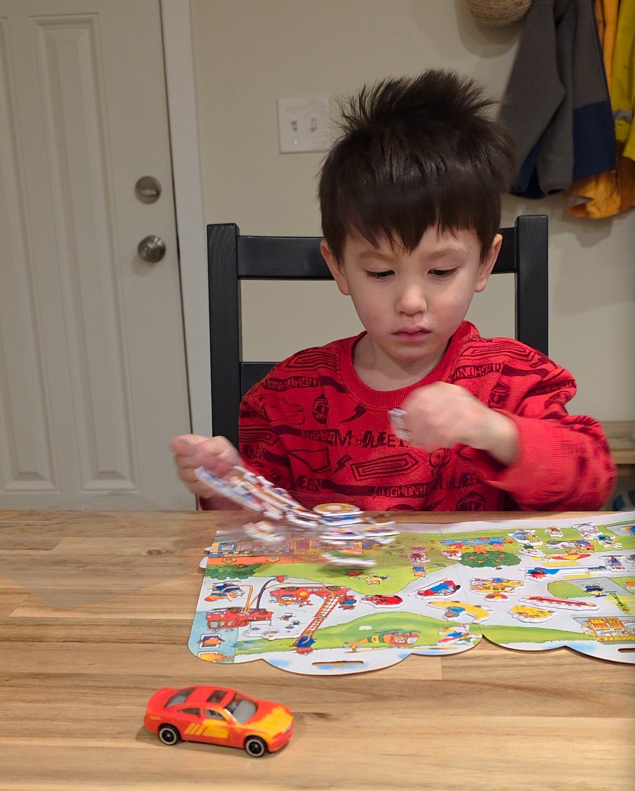 Screengrab of a video from the S25 Ultra of a child sitting at a table playing with stickers