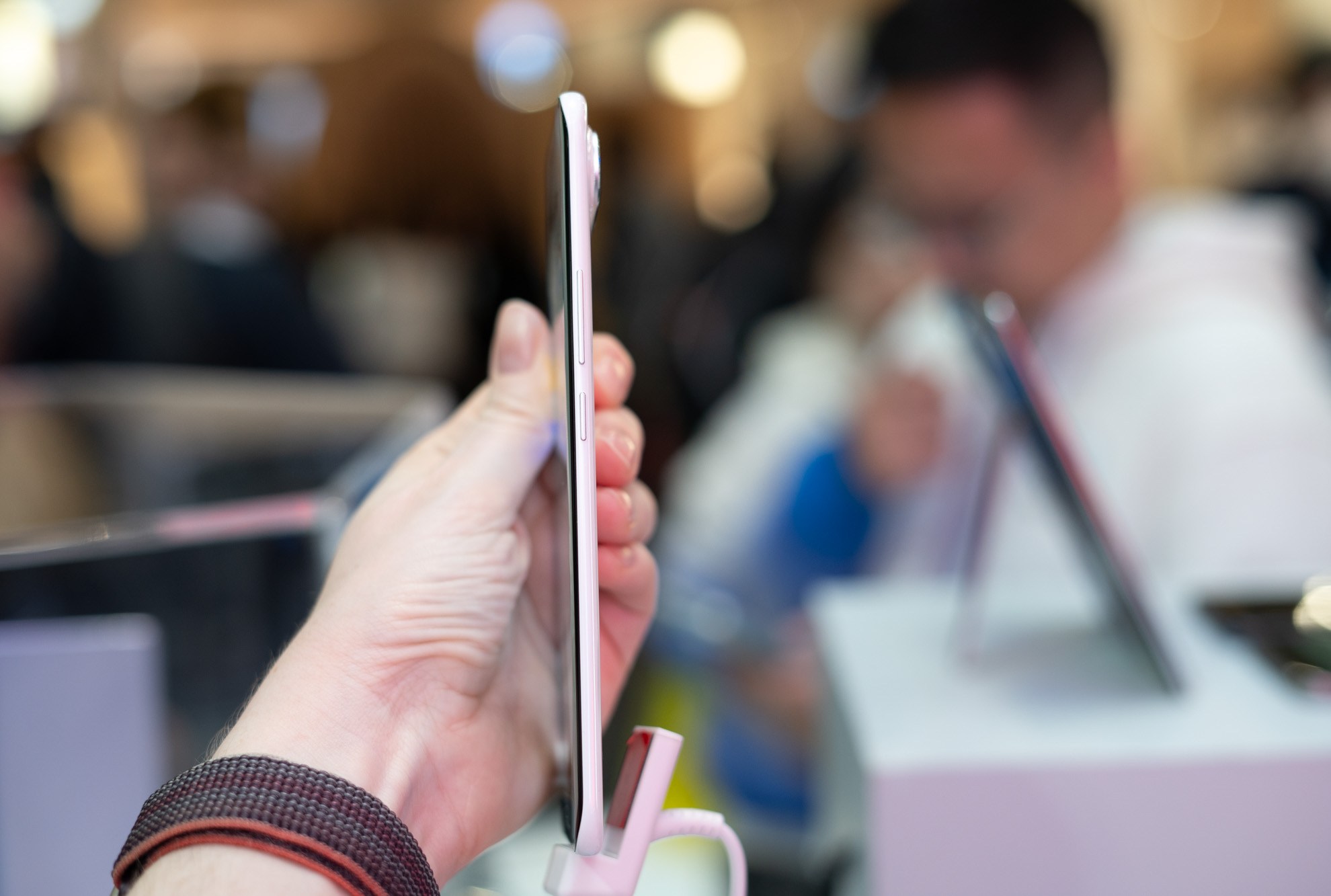 The Tecno Spark Slim concept phone being held sideways to demonstrate how thin it is.