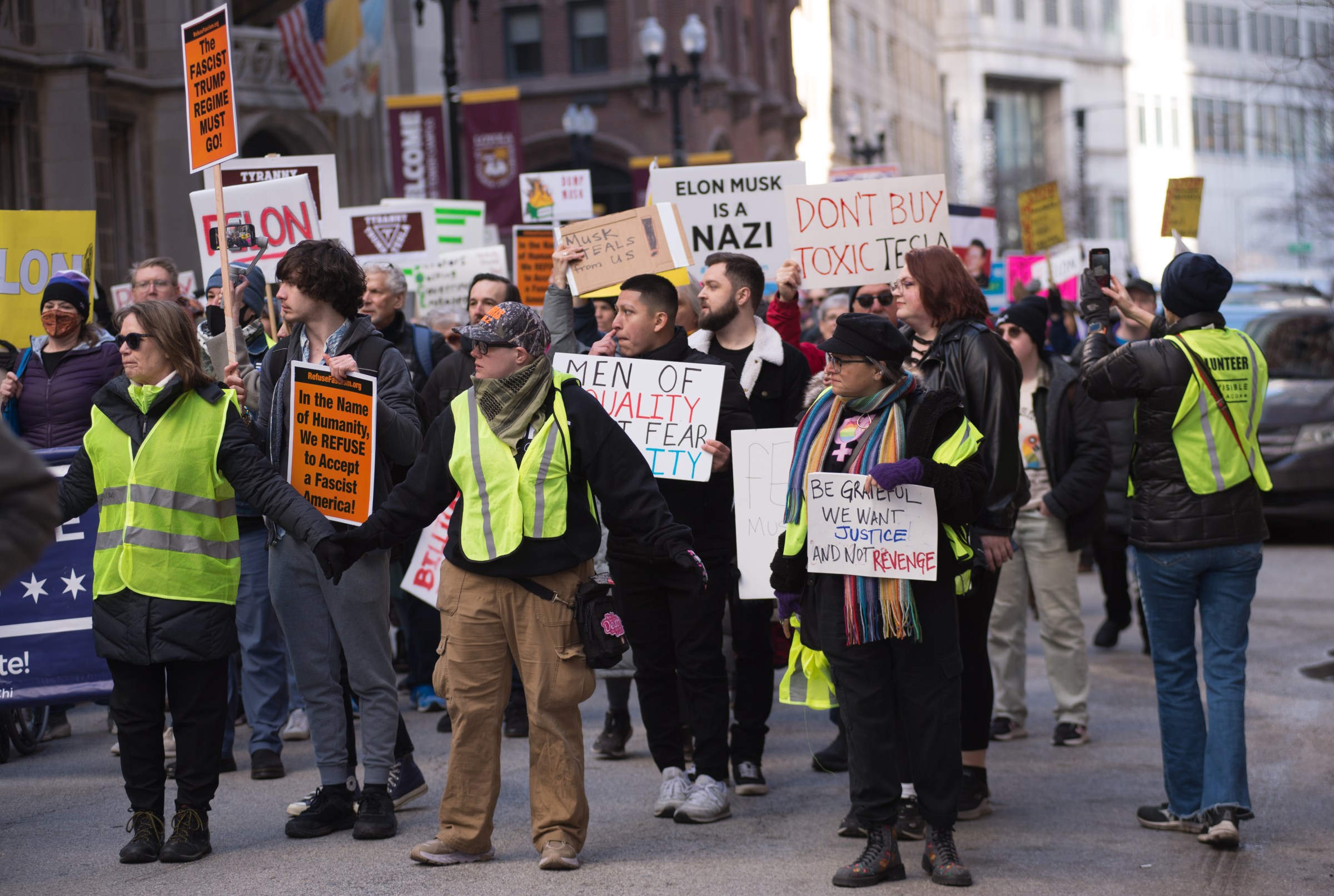 Protestors outside a Tesla dealership in Chicago.