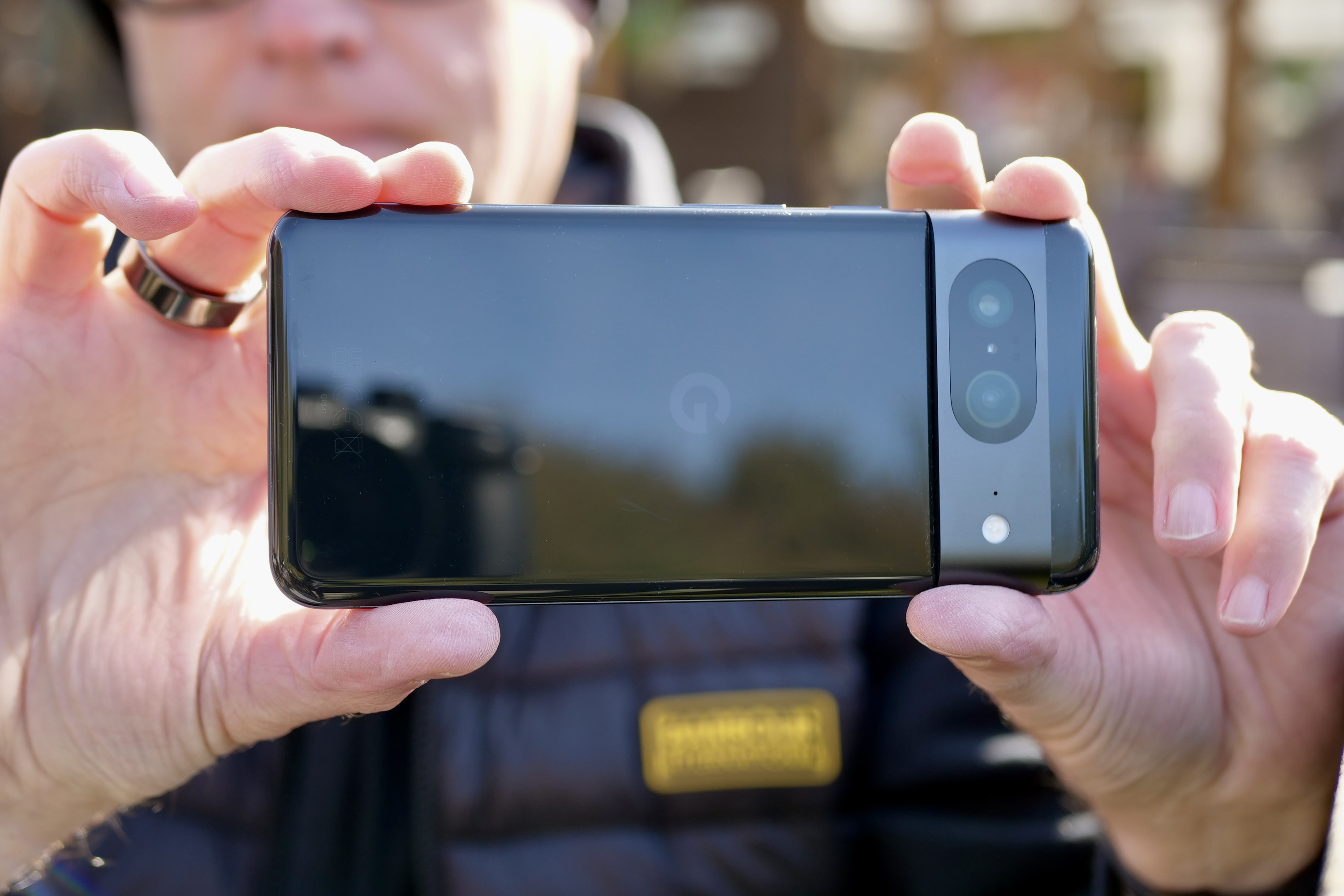 A person taking a photo with the Google Pixel 8.