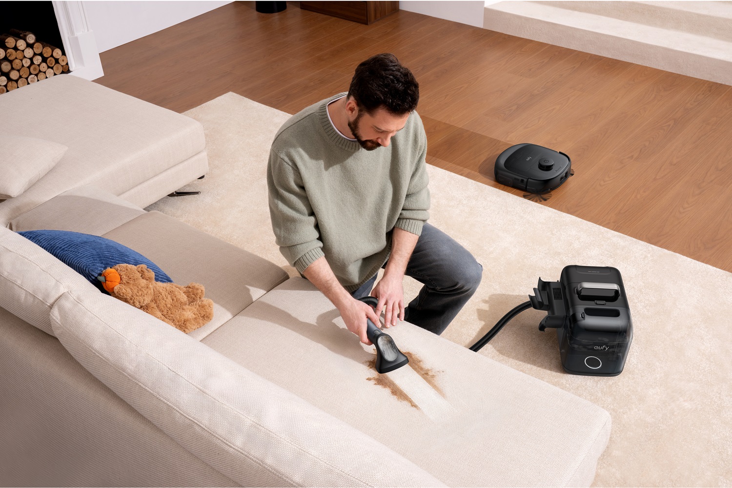 A man using the Eufy Omni E28 Robot Vacuum.