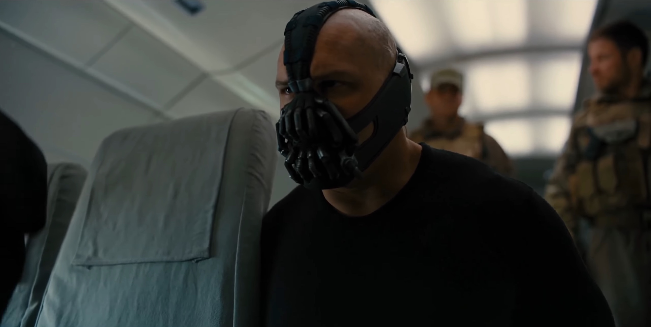 Bane on an airplane in