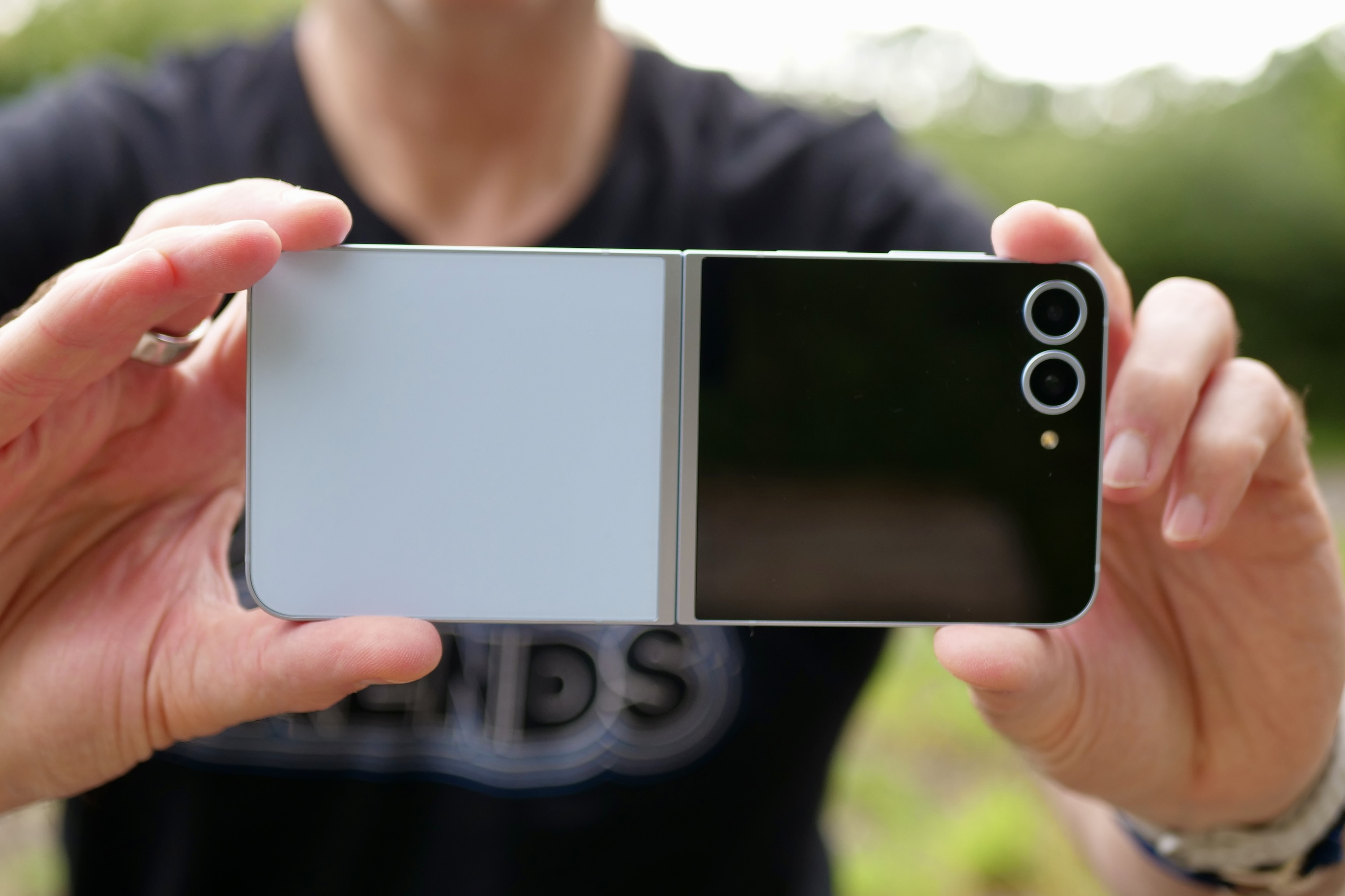 A person taking a photo with the Samsung Galaxy Z Flip 6.