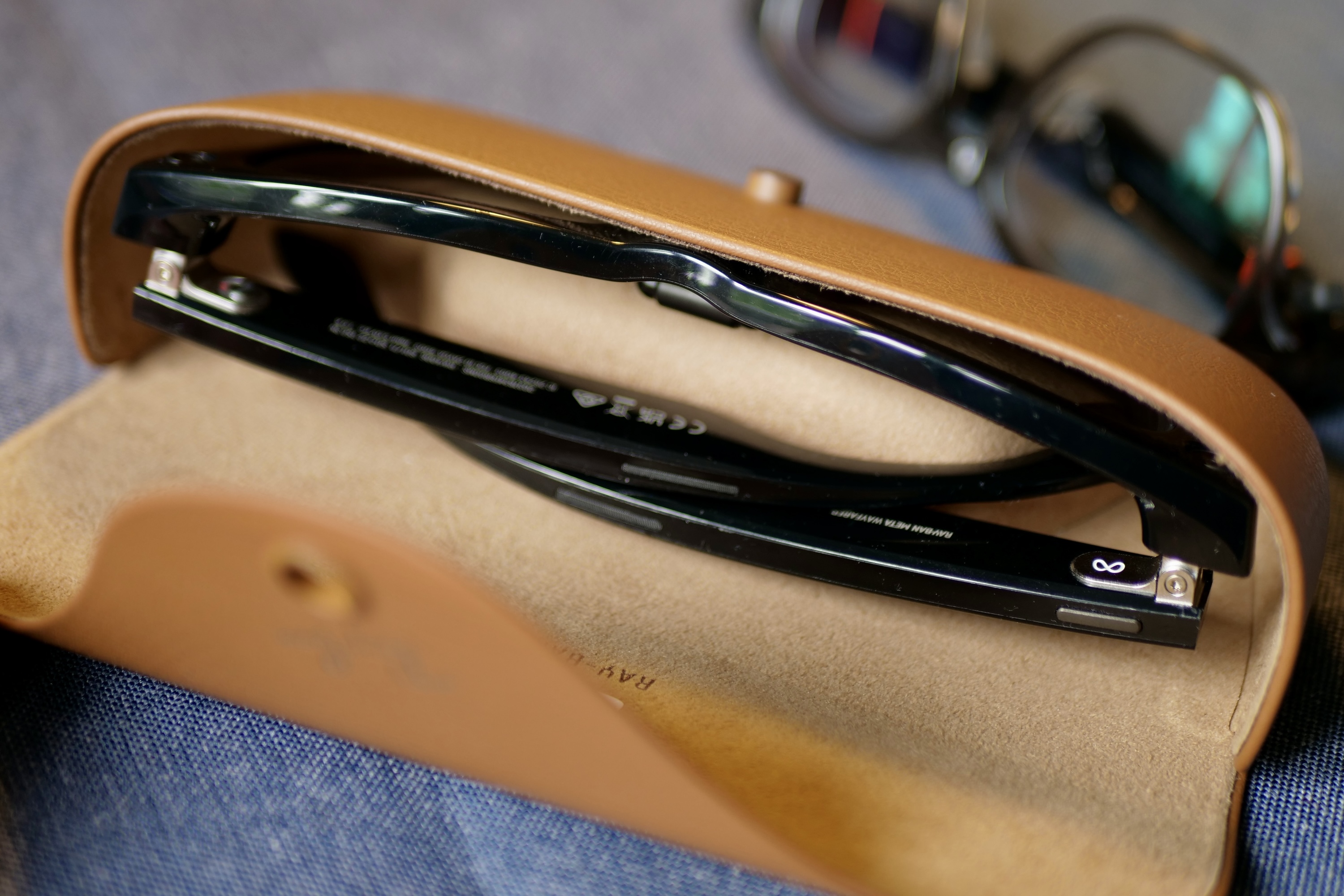 The Ray-Ban Meta smart glasses in the case.