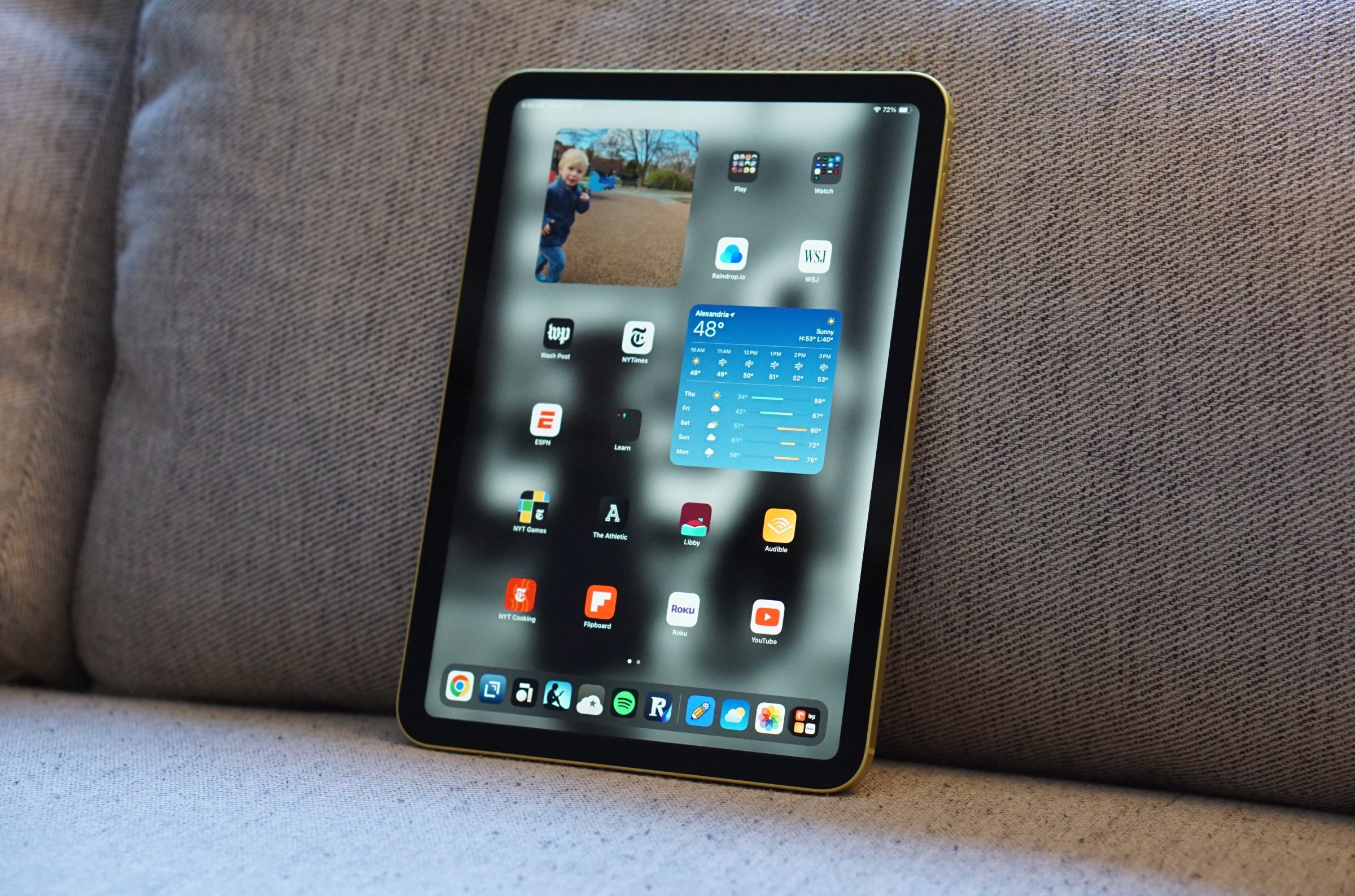 An 11th-generation iPad on a couch.