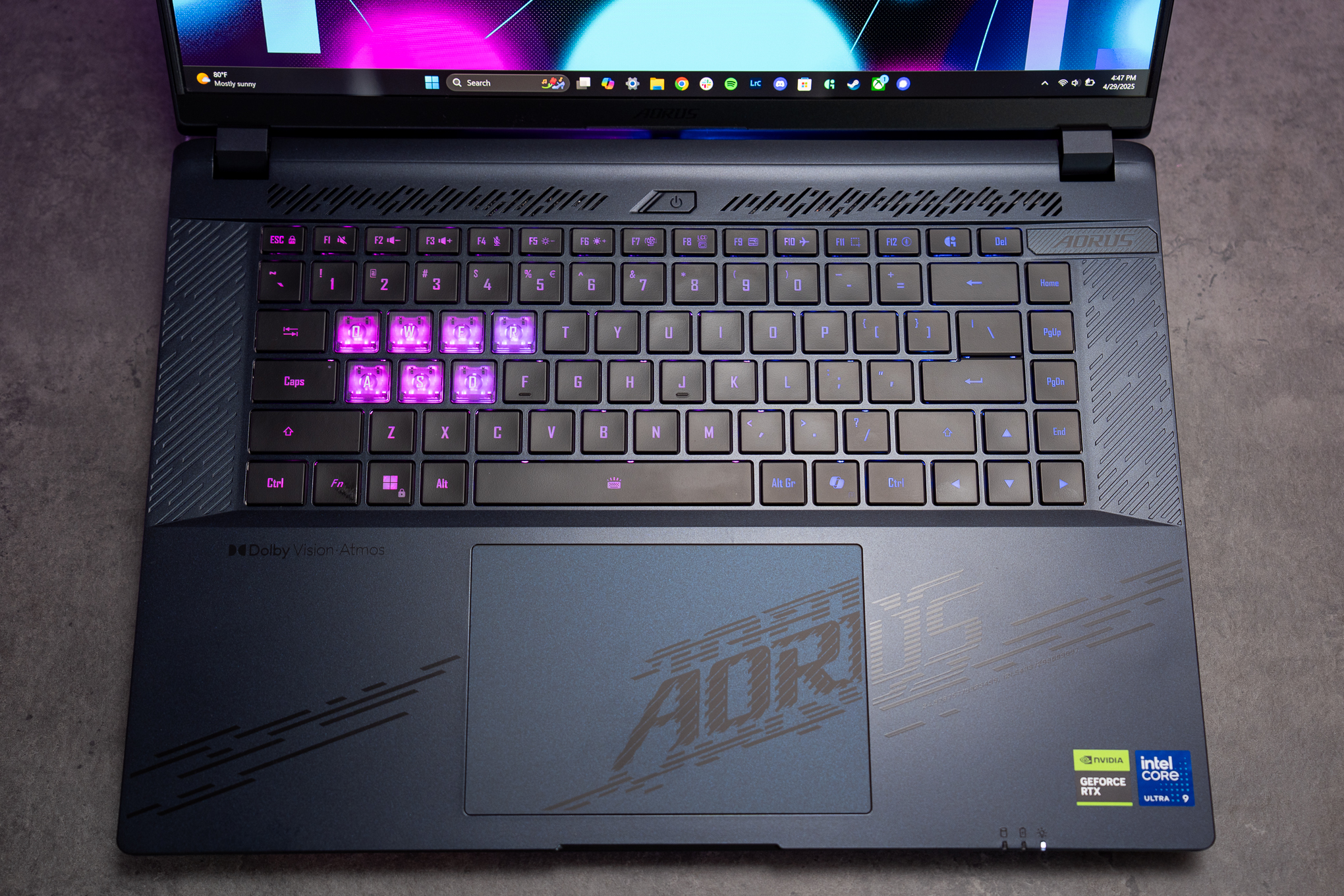 The keyboard only has three-zone RGB lighting instead of per-key customization, but the see-though WASD and adjacent keys are fun.