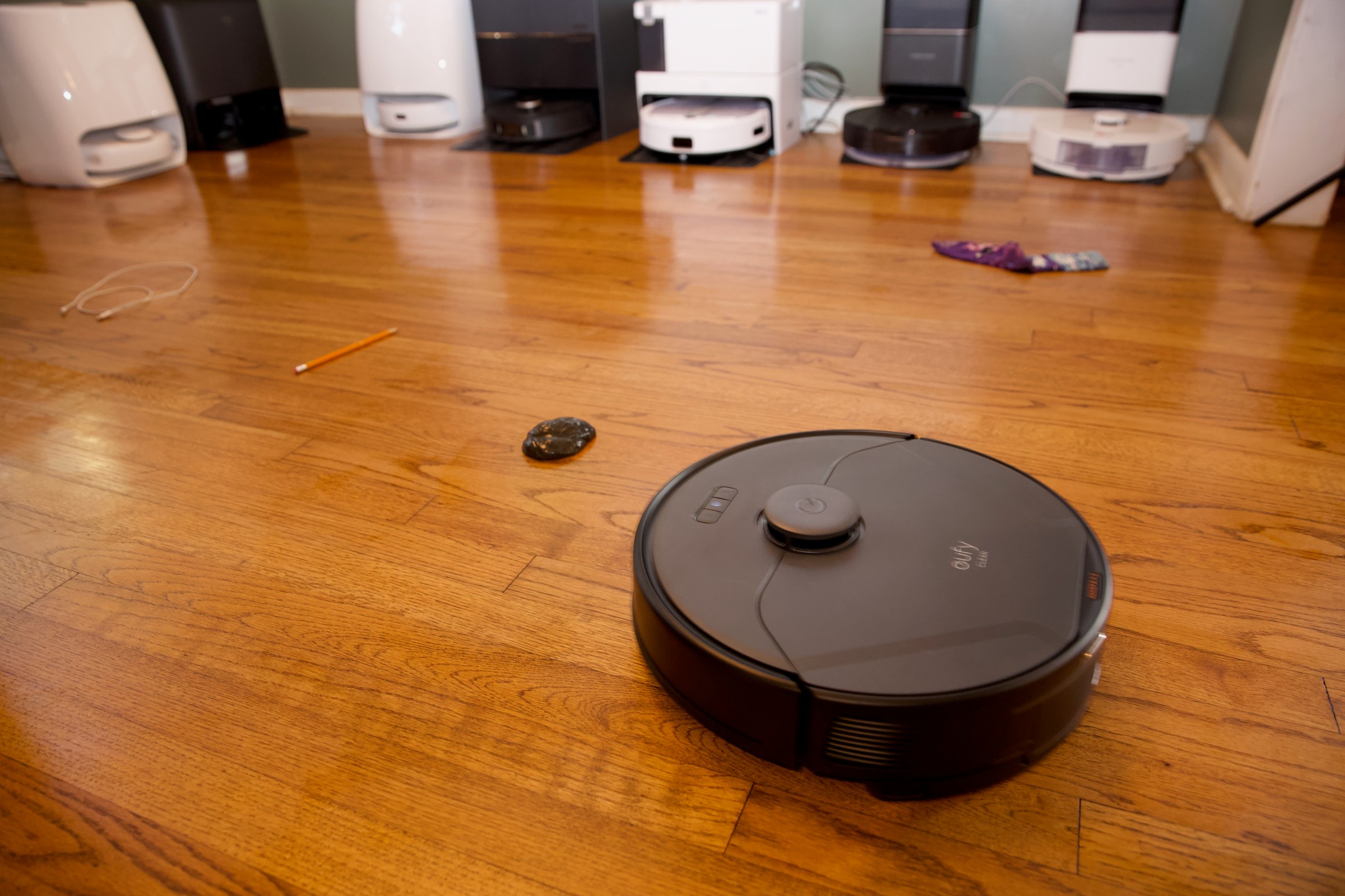 A Eufy robot vac running the gauntlet in my test lab / sitting room.