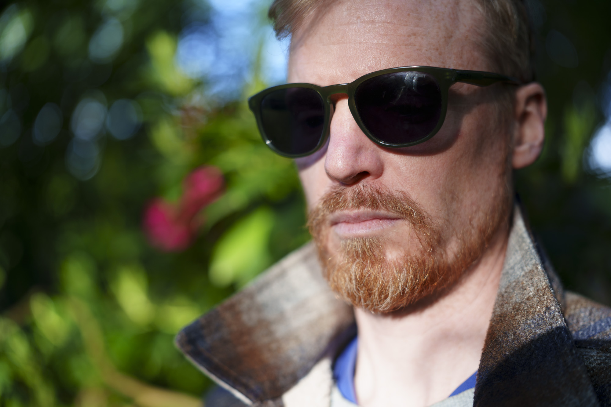 Head and shoulder portrait of a man in sunglasses and jacket, taken with the Sony FE 50-150mm F2 GM lens, taken with the Sony FE 50-150mm F2 GM lens