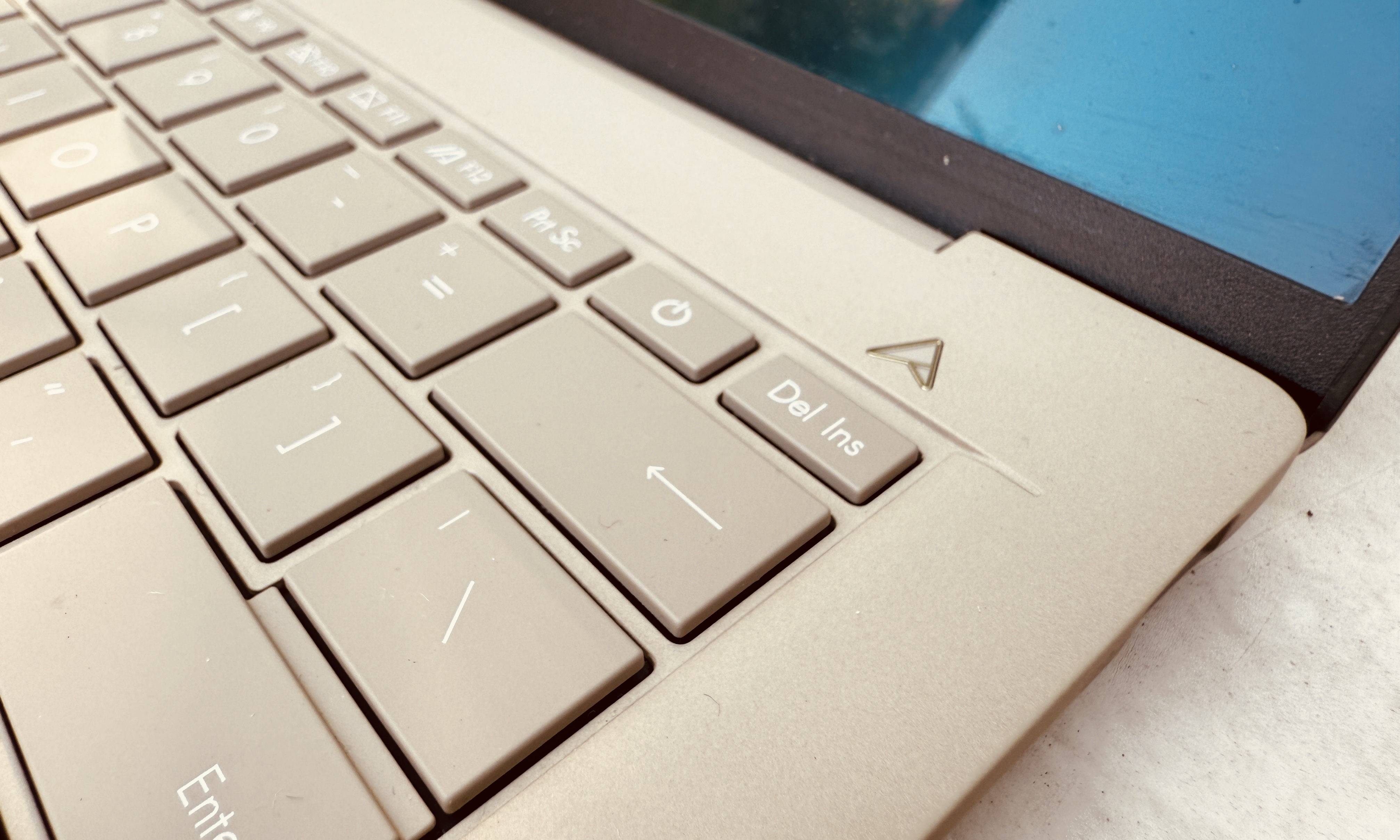 Closeup view of keys on Asus ZenBook A14 laptop.