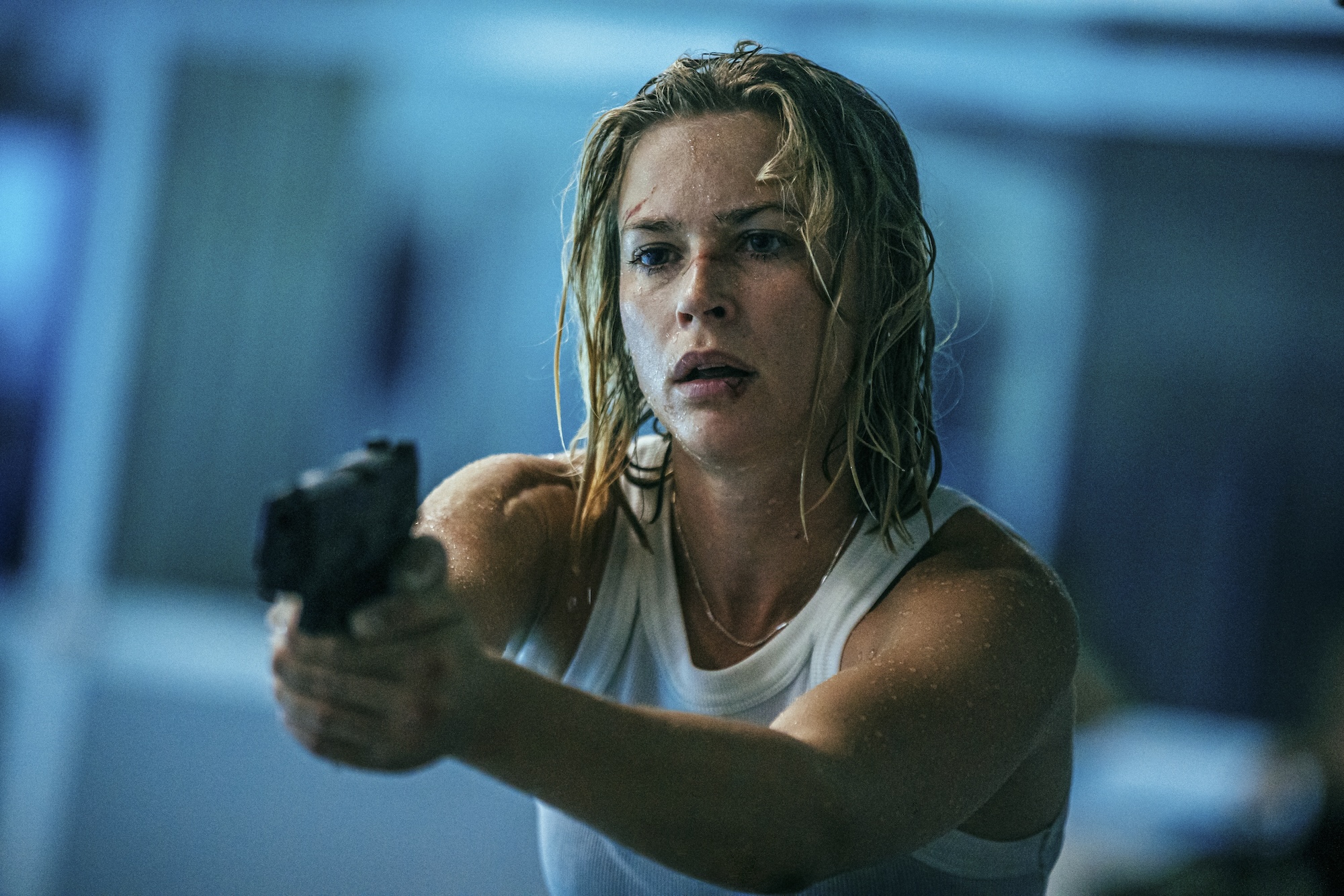 A woman points a gun in Exterritorial.