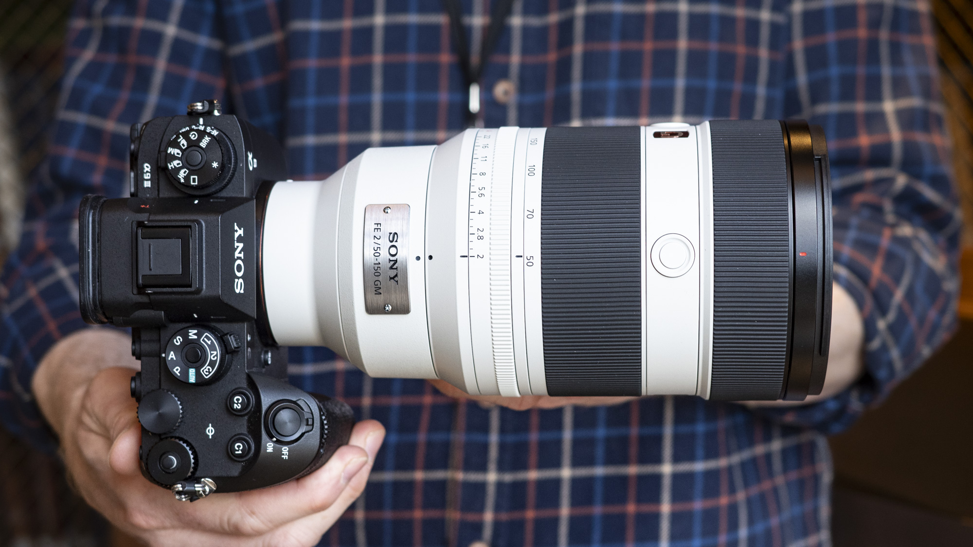 Sony FE 50-150mm F2 GM lens attached to a Sony A9 III, in the hand
