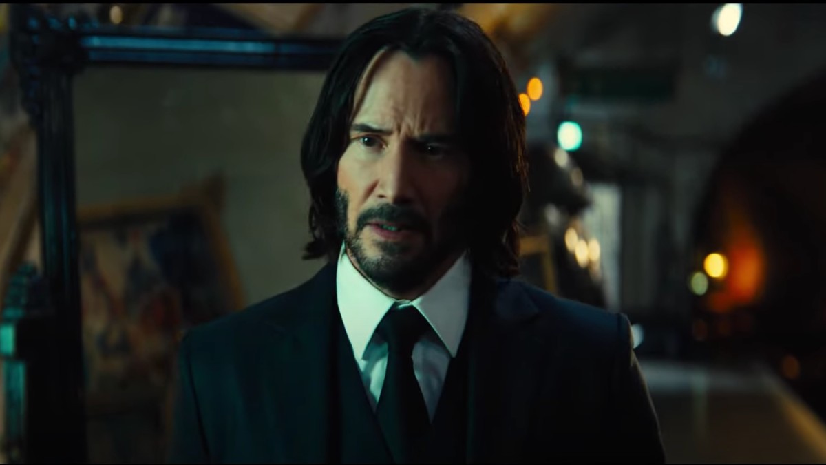 Keanu Reeves stares and walks in a scene from John Wick: Chapter 4.
