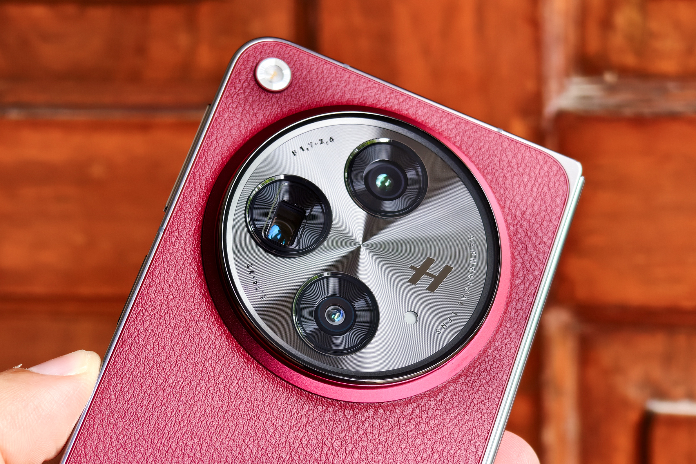 Close up of the camera module on the OnePlus Open Apex Edition Crimson Shadow red.
