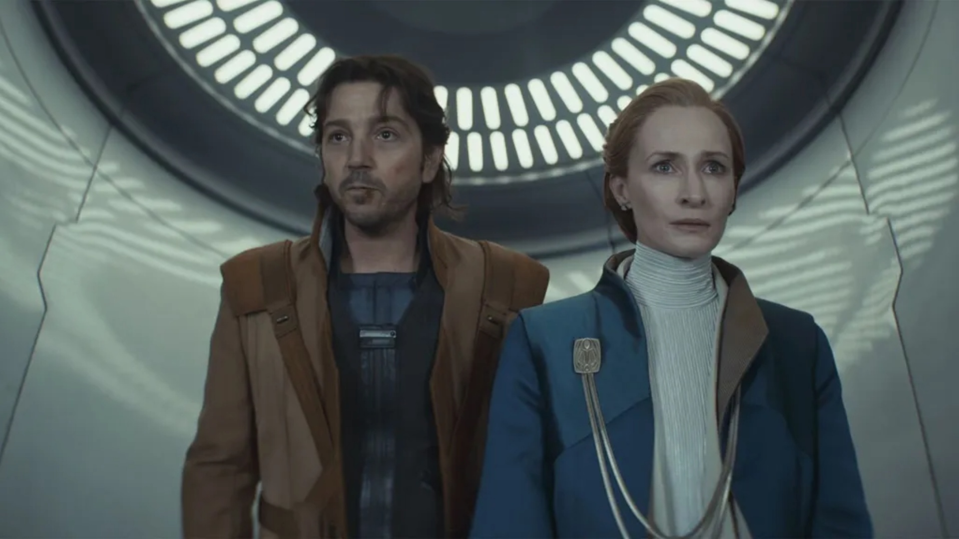 Cassian escorts Mon Mothma out of the senate in Andor season 2.