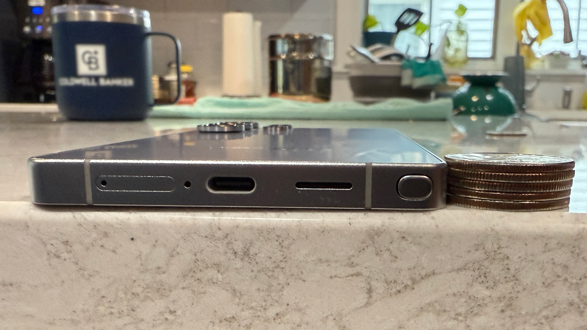 Samsung Galaxy S25 Ultra with quarters