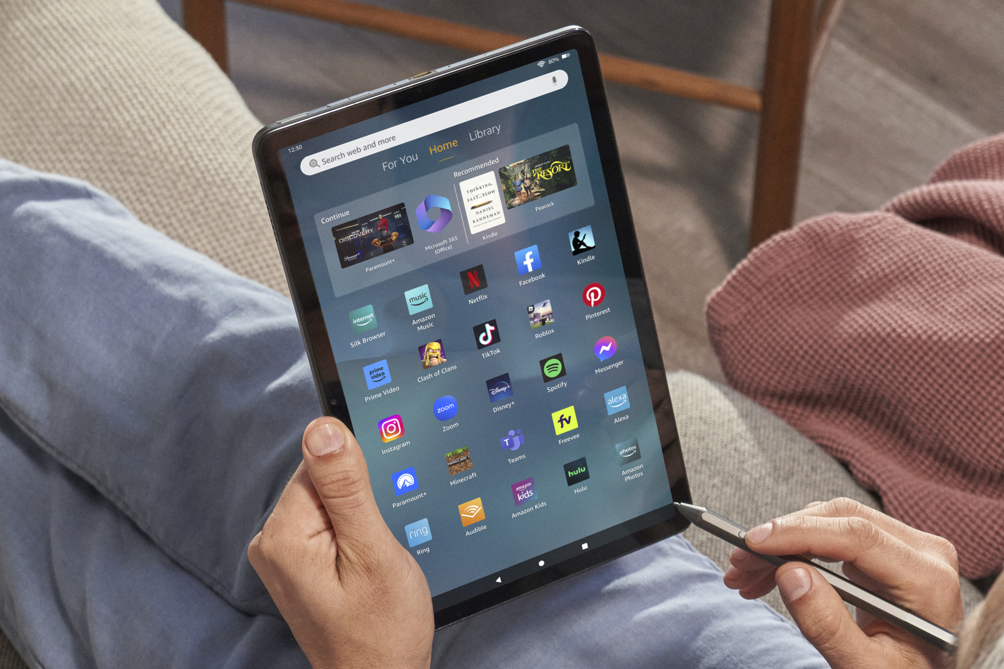 Someone holding the Amazon Fire Max 11 tablet.