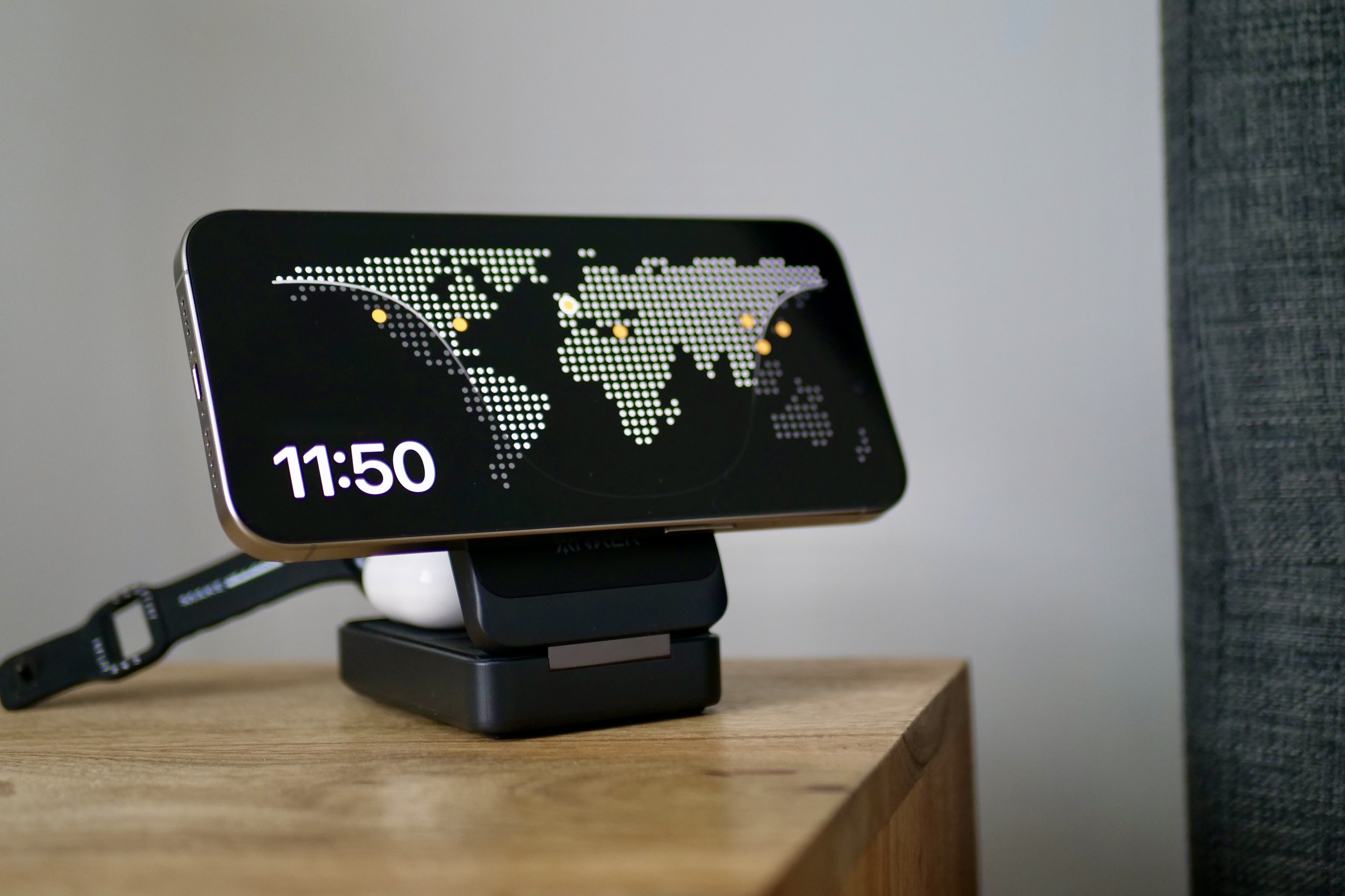 The iPhone 15 Pro Max with Standby mode on the Anker MagGo Wireless Charging Station.