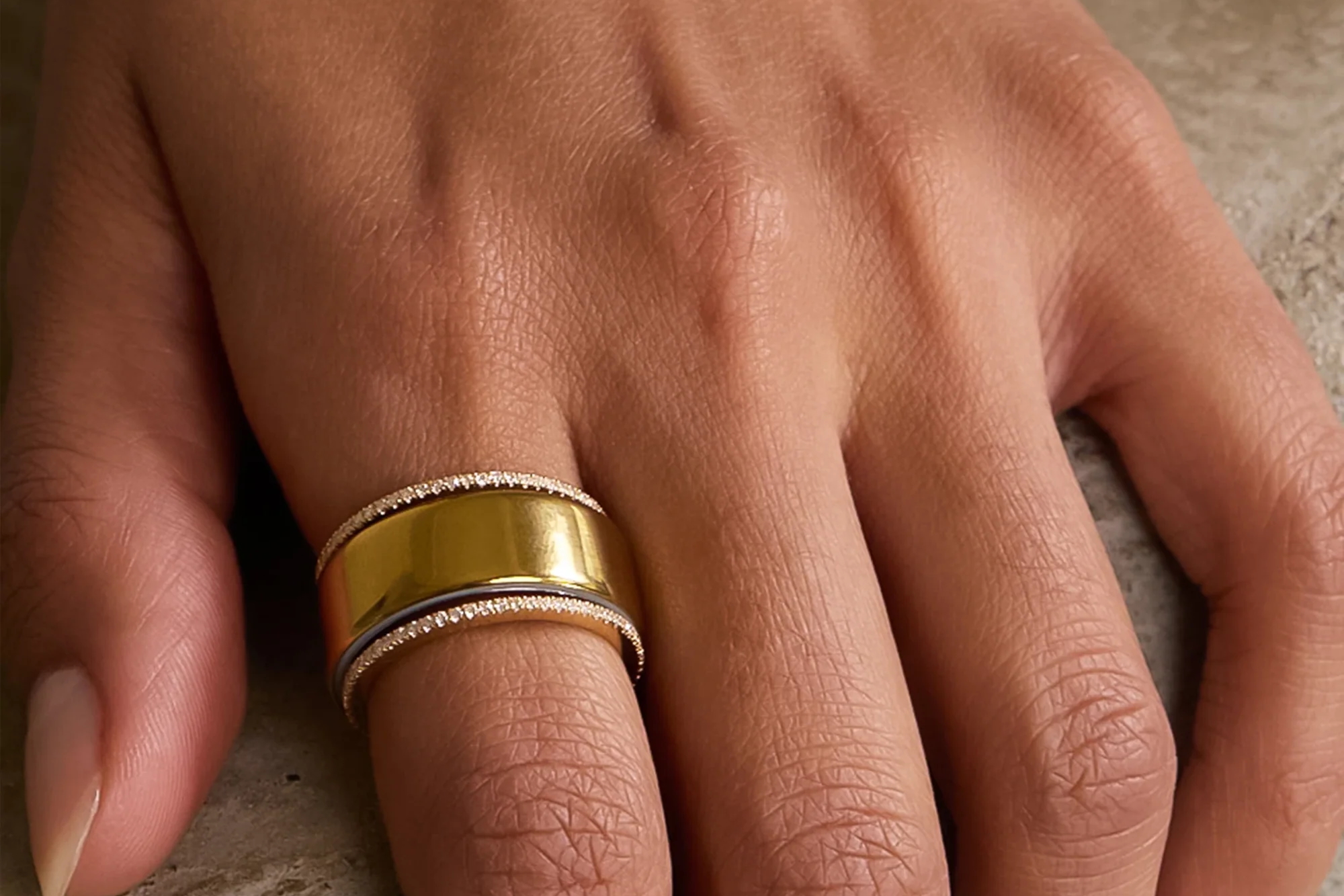 A person wearing the Suzanne Kalan Classic Pave Diamond Mini Eternity Tech Ring Jackets.