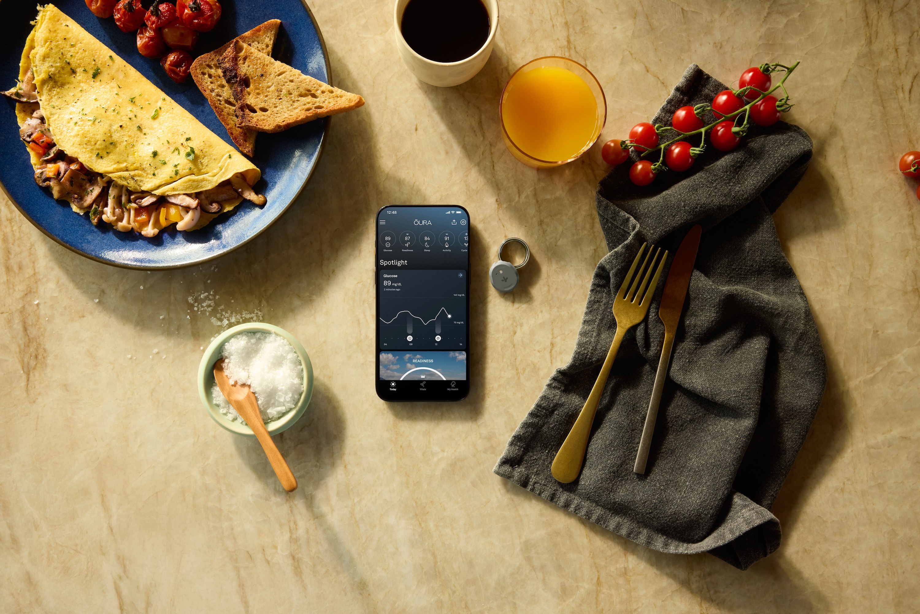 A promotional image for the Oura Ring's Dexcom Stelo integration.