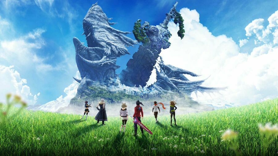 Noah and his team standing in a green field.