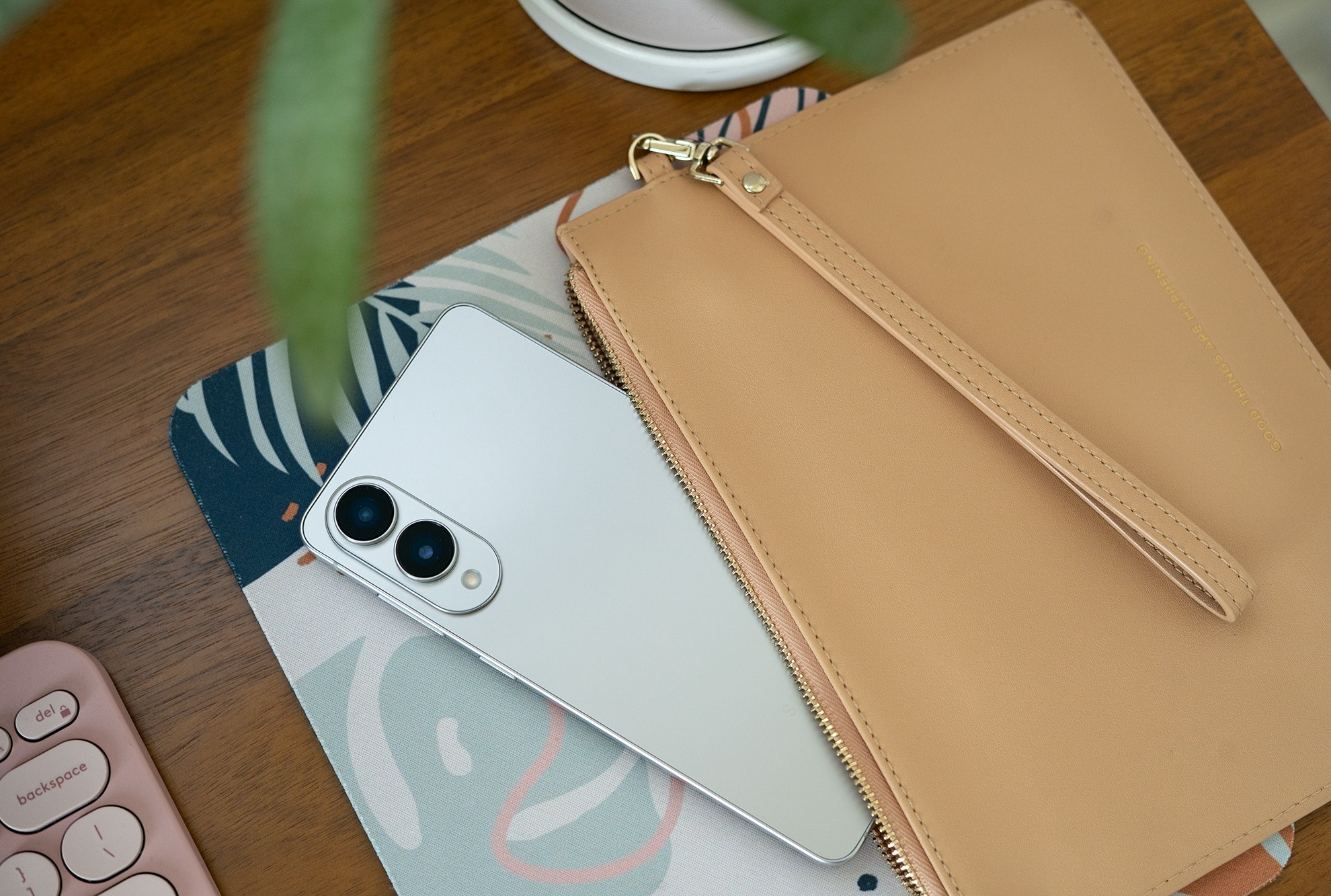 Samsung Galaxy S25 Edge in a slim wristlet bag.