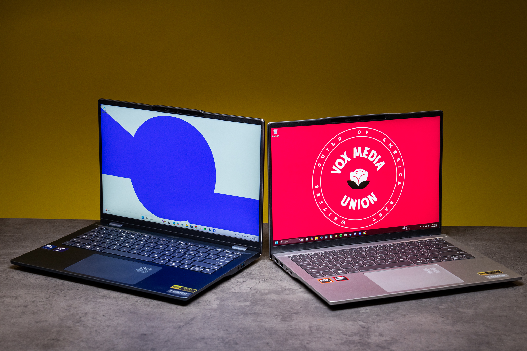 The Intel version of the Swift 14 AI (left) comes in a dark blue, while the AMD (right) gets a standard silver.
