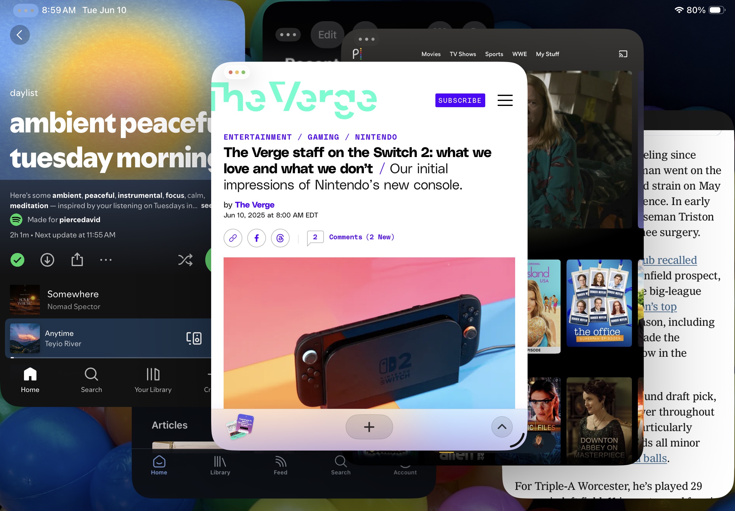 Several apps open, in multi-window view, on an iPad.