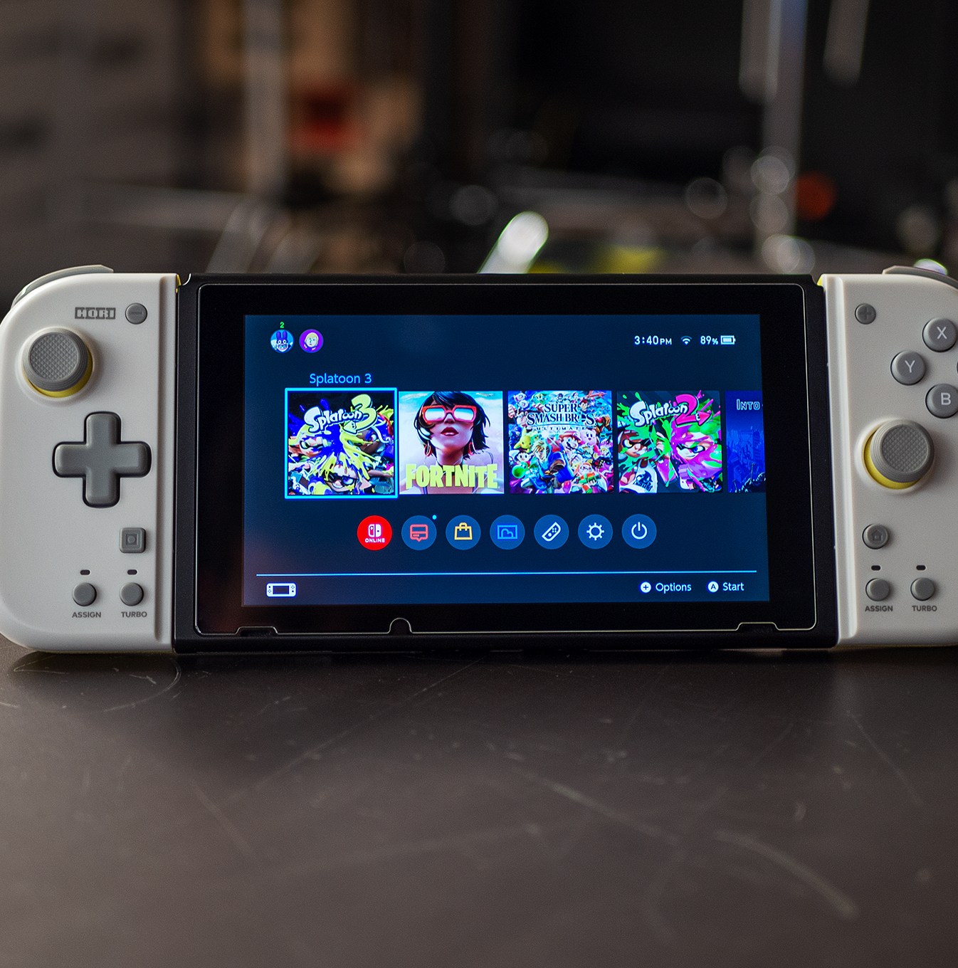 Nintendo Switch console shown with Hori’s Split Pad Compact controllers plugged in.