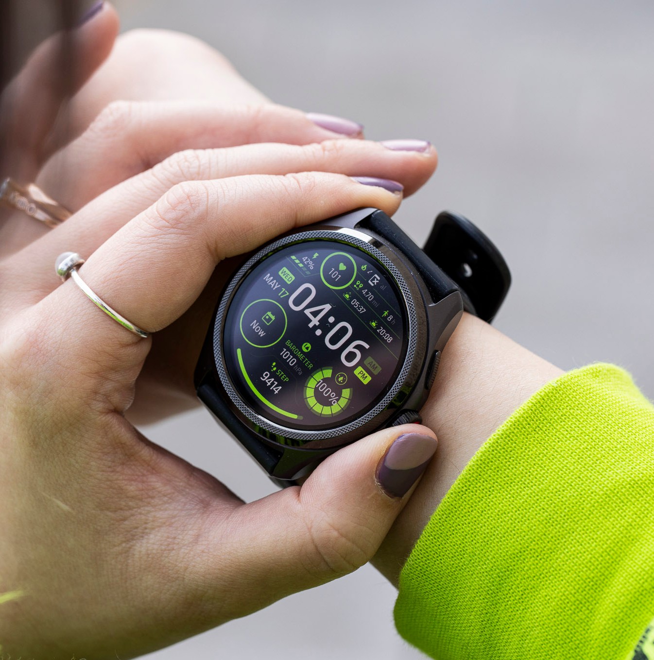Close-up of person pressing the TicWatch Pro 5’s digital crown