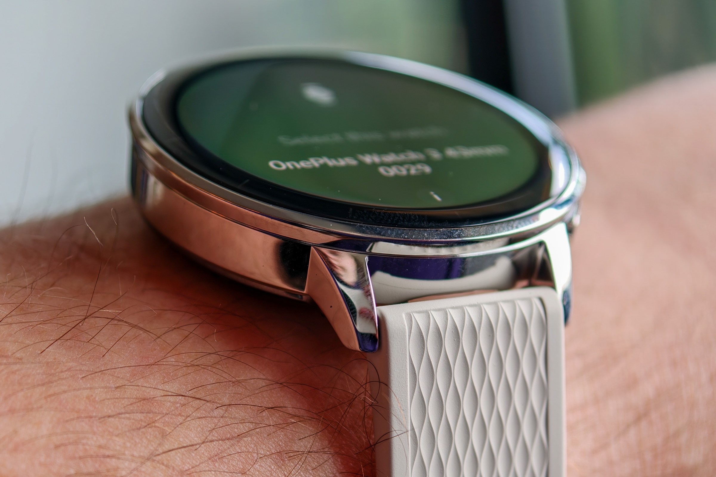 OnePlus Watch 3 43mm on a manâs wrist from a side angle