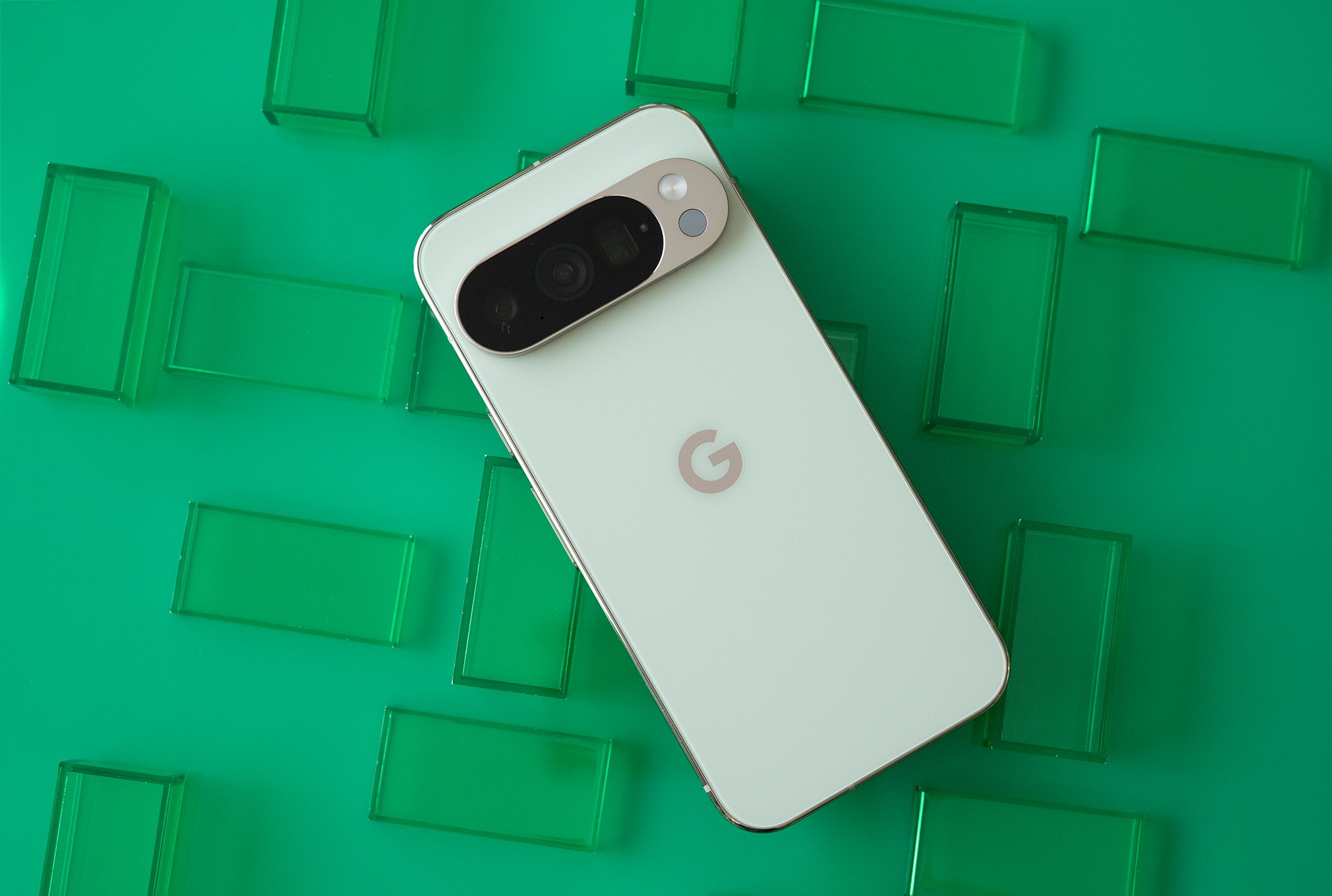 Google Pixel 10 Pro showing back panel on a grid of green rectangles