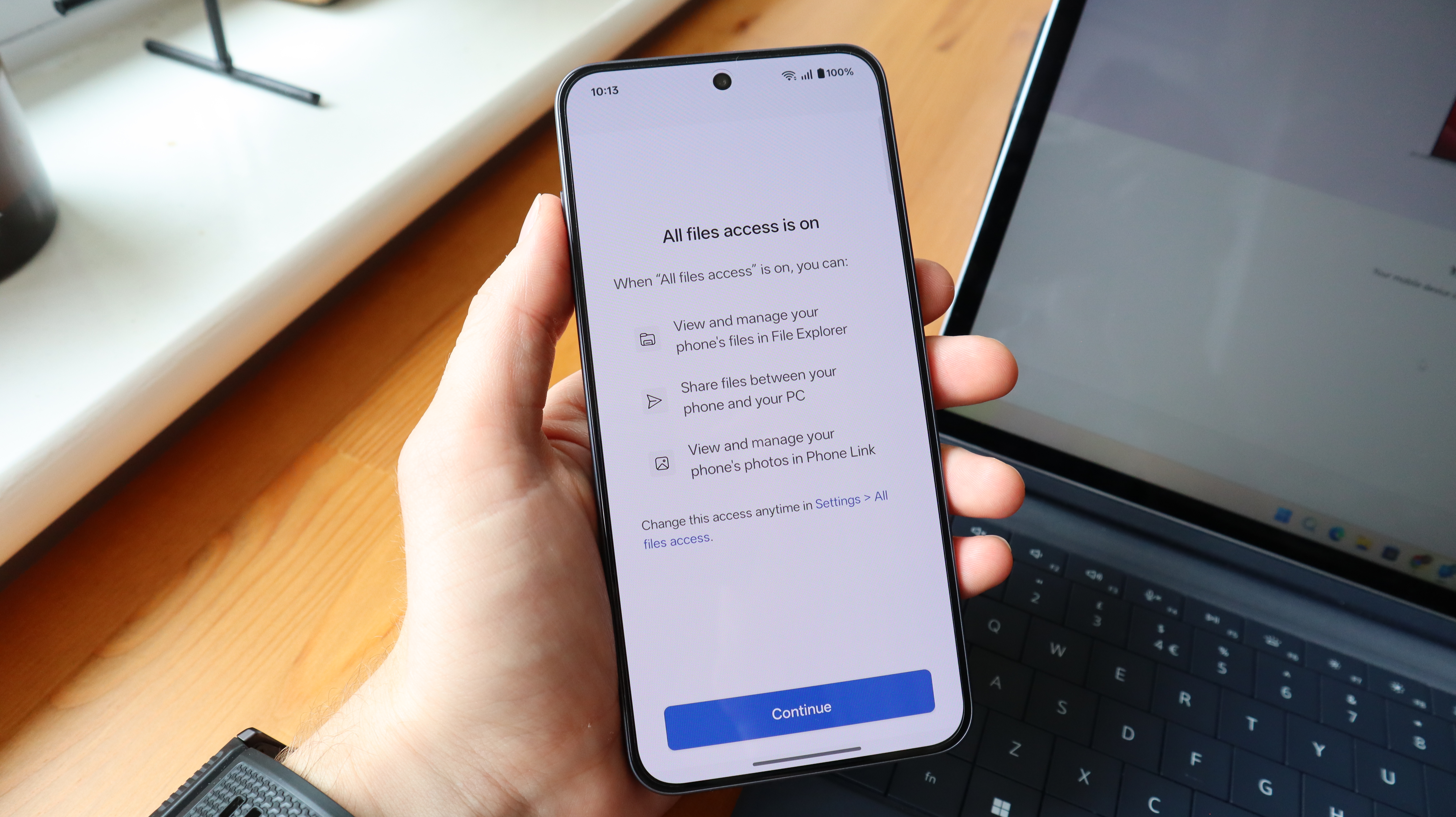An Android user connecting his phone to a Windows PC