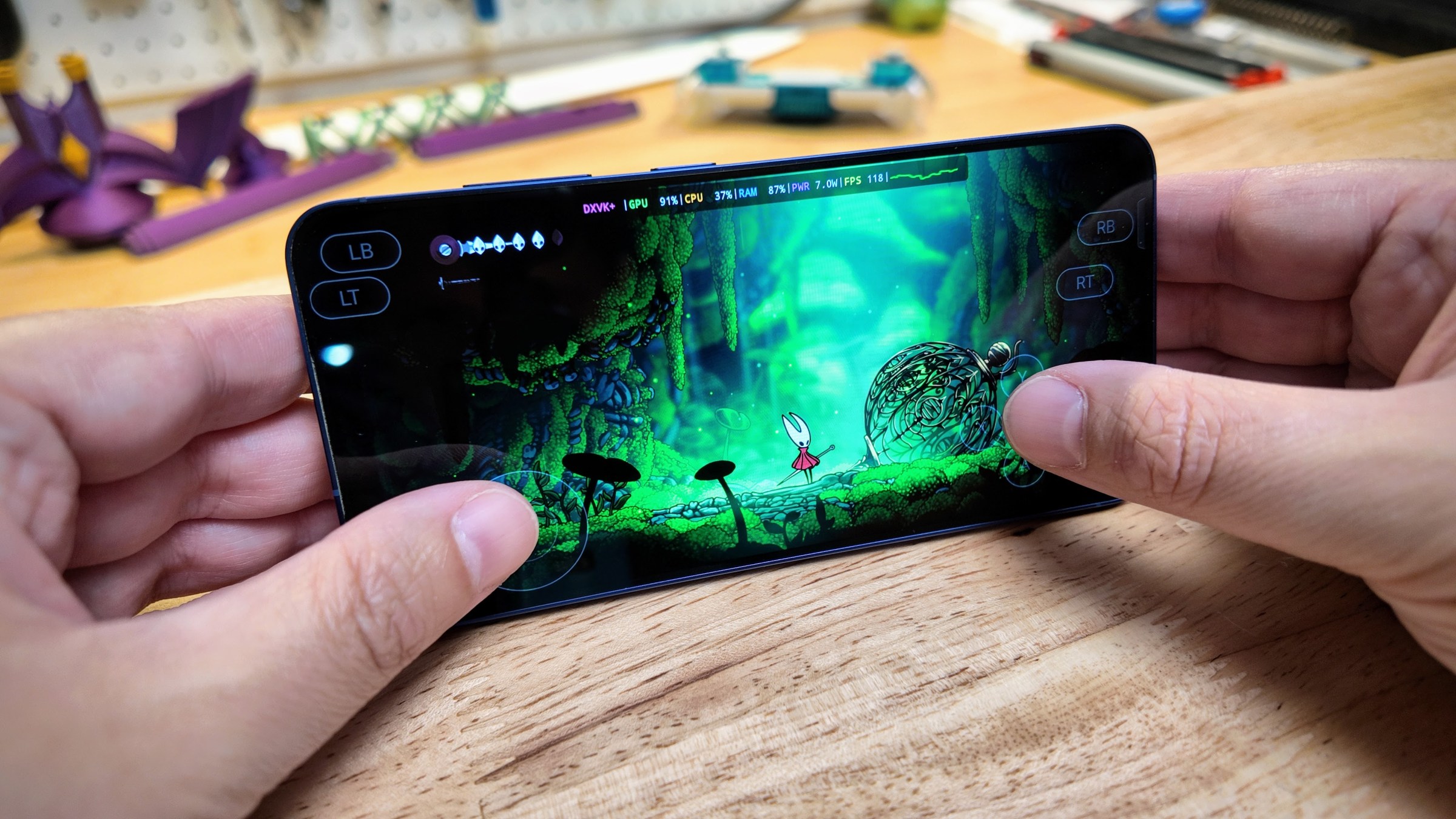 Hollow Knight Silksong running on a phone.