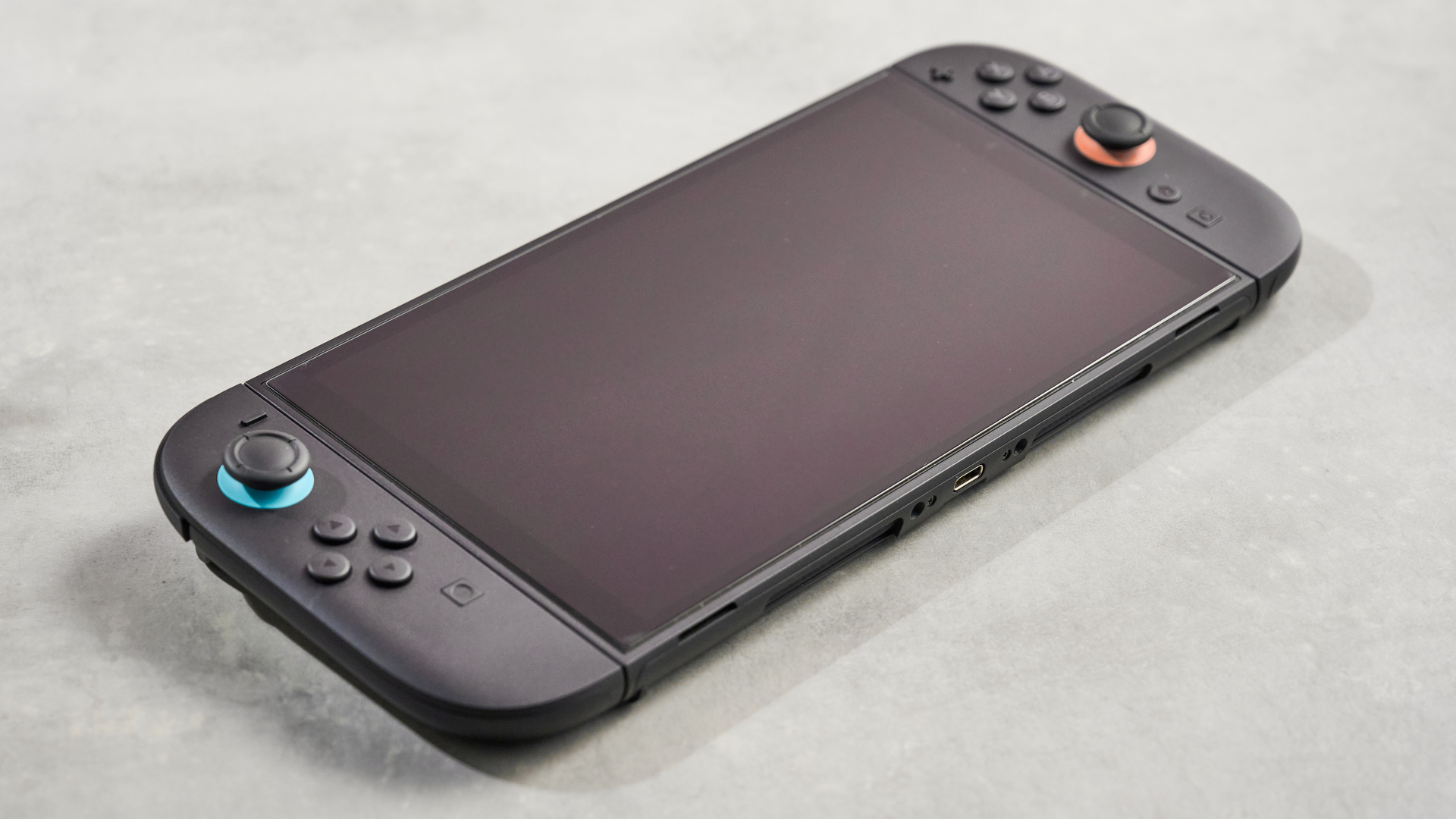 The Belkin Tempered Glass Anti-Reflective Screen Protector showing no scratches, despite previous attempts to scratch it with a key.