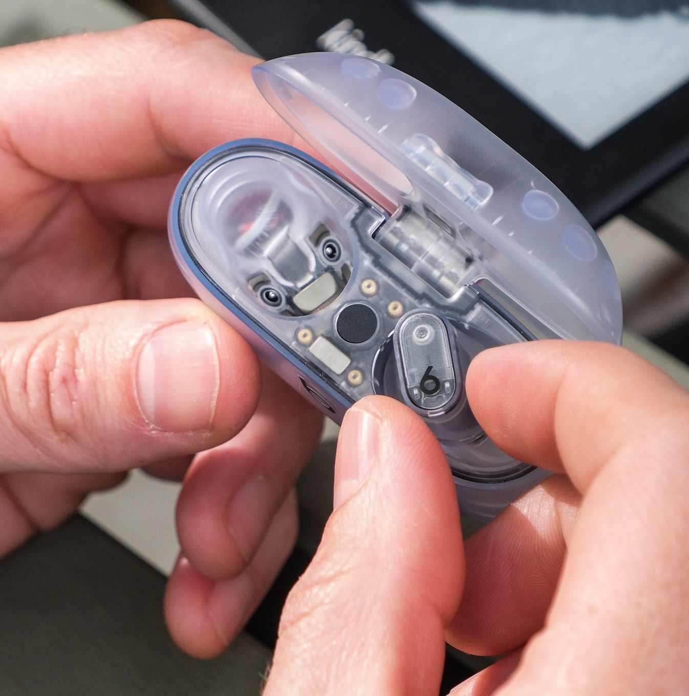 A photo of Beats’ translucent Studio Buds Plus earbuds.