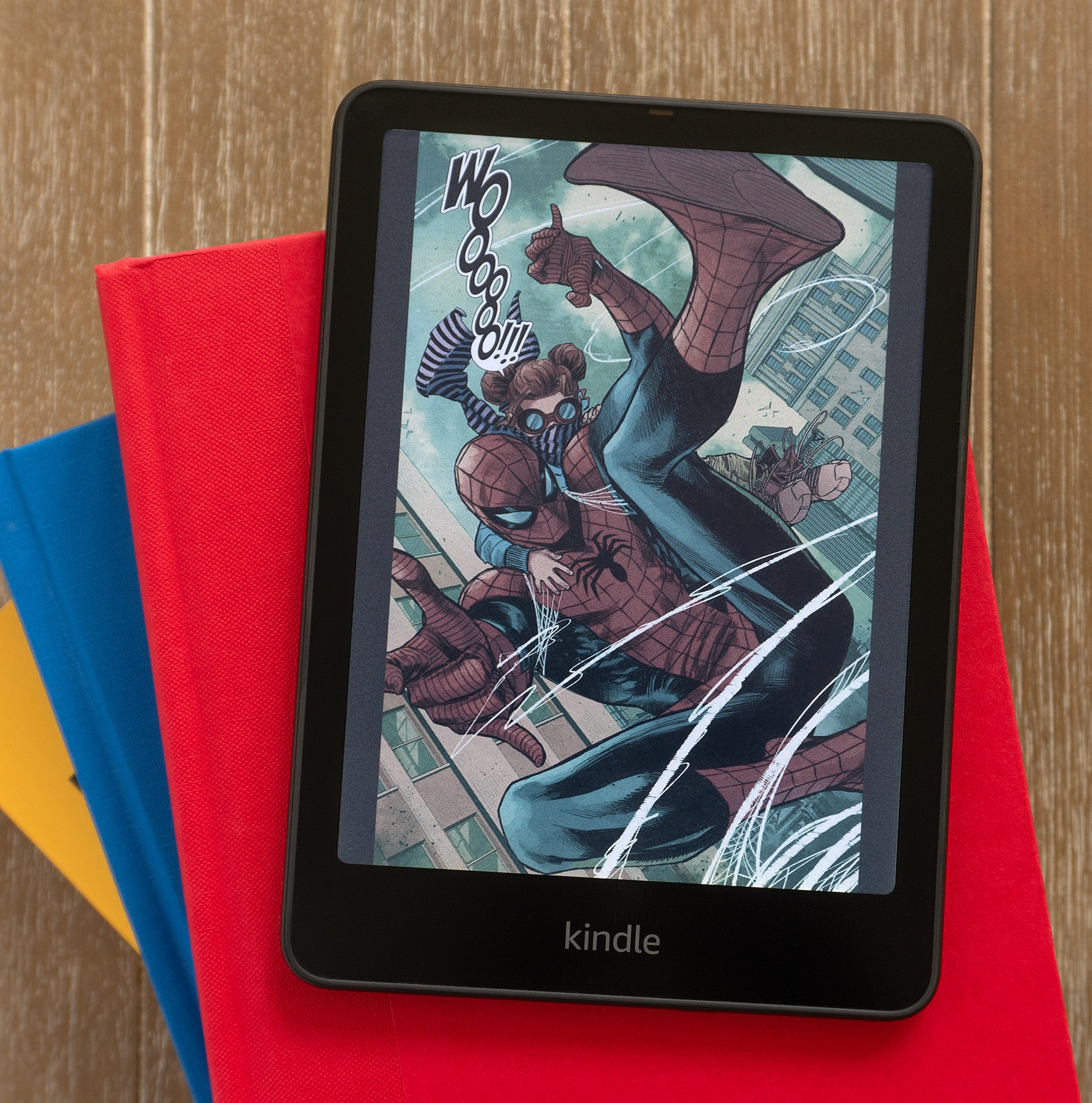 The Amazon Kindle Colorsoft on a stack of books.