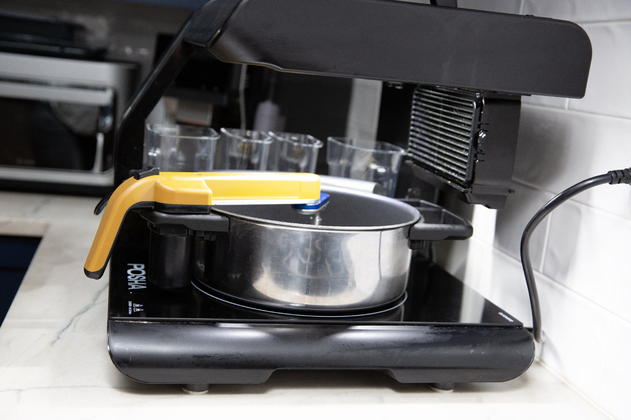 Side view of Posha cooking robot.