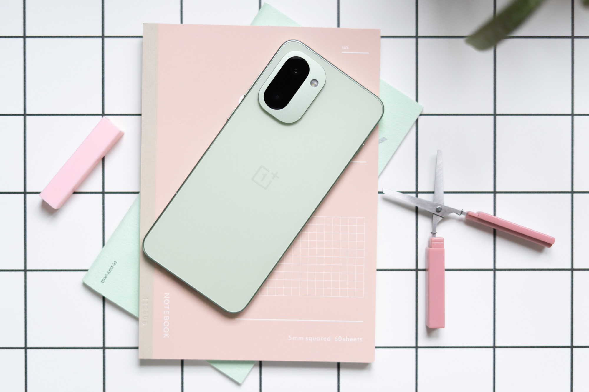 OnePlus 15R in green on a desk