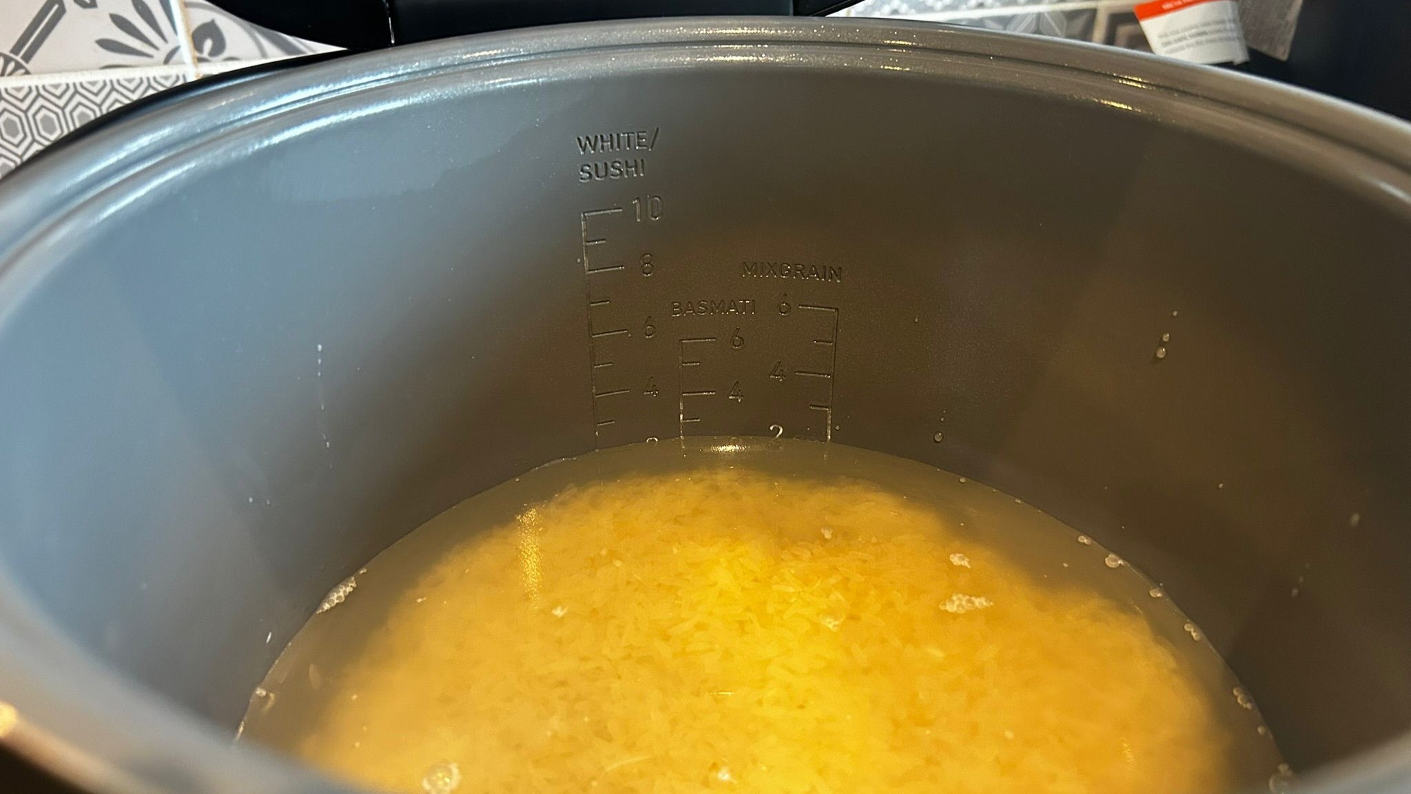 White rice in Cosori 5L Rice Cooker with liquid filled to line